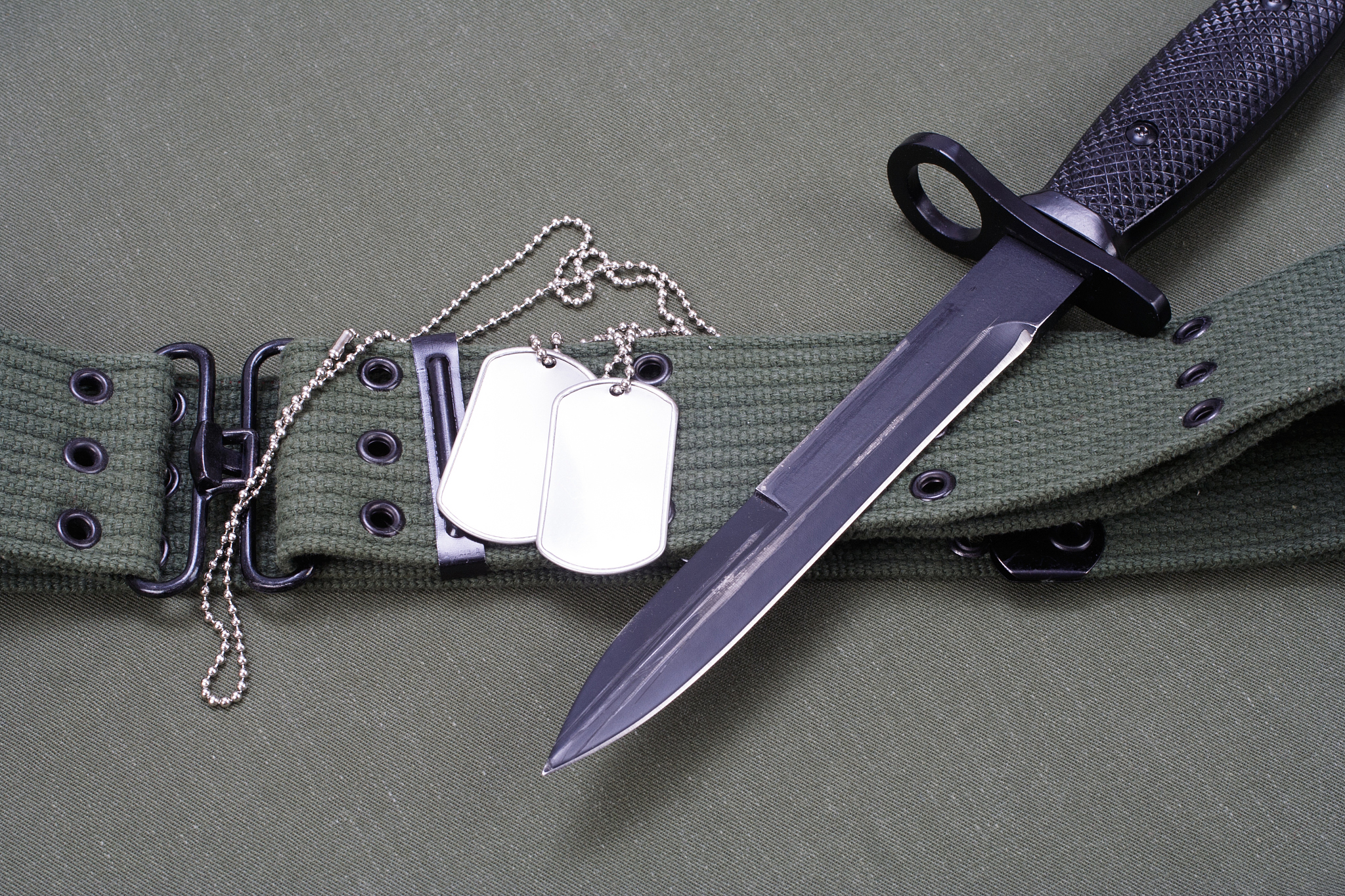 m16 rifle bayonet on uniform background
