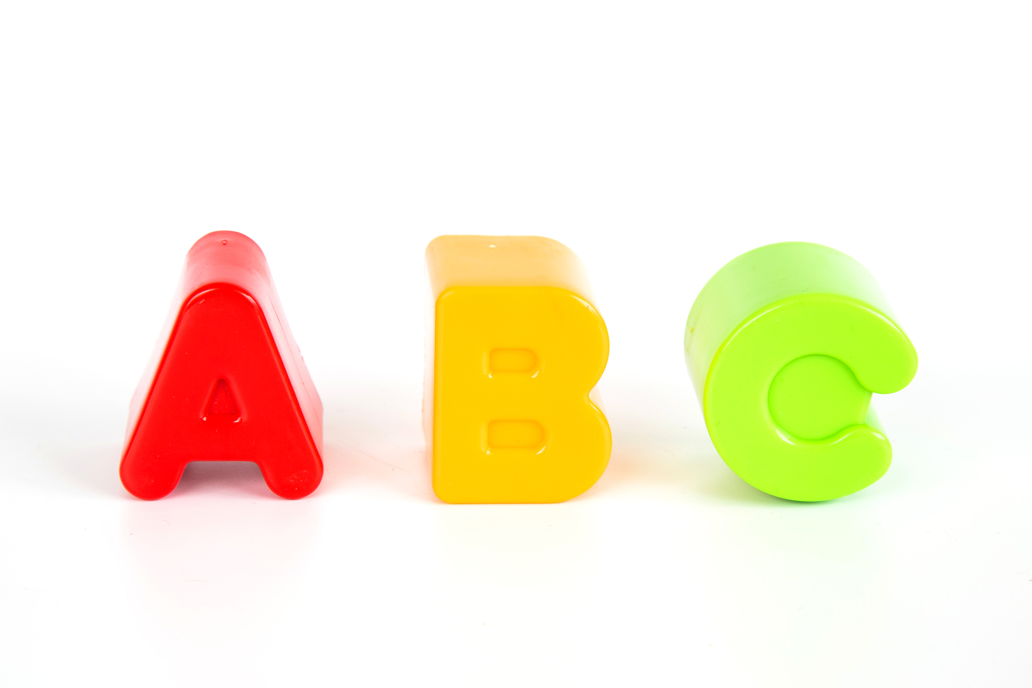 a b c letters toys on white background