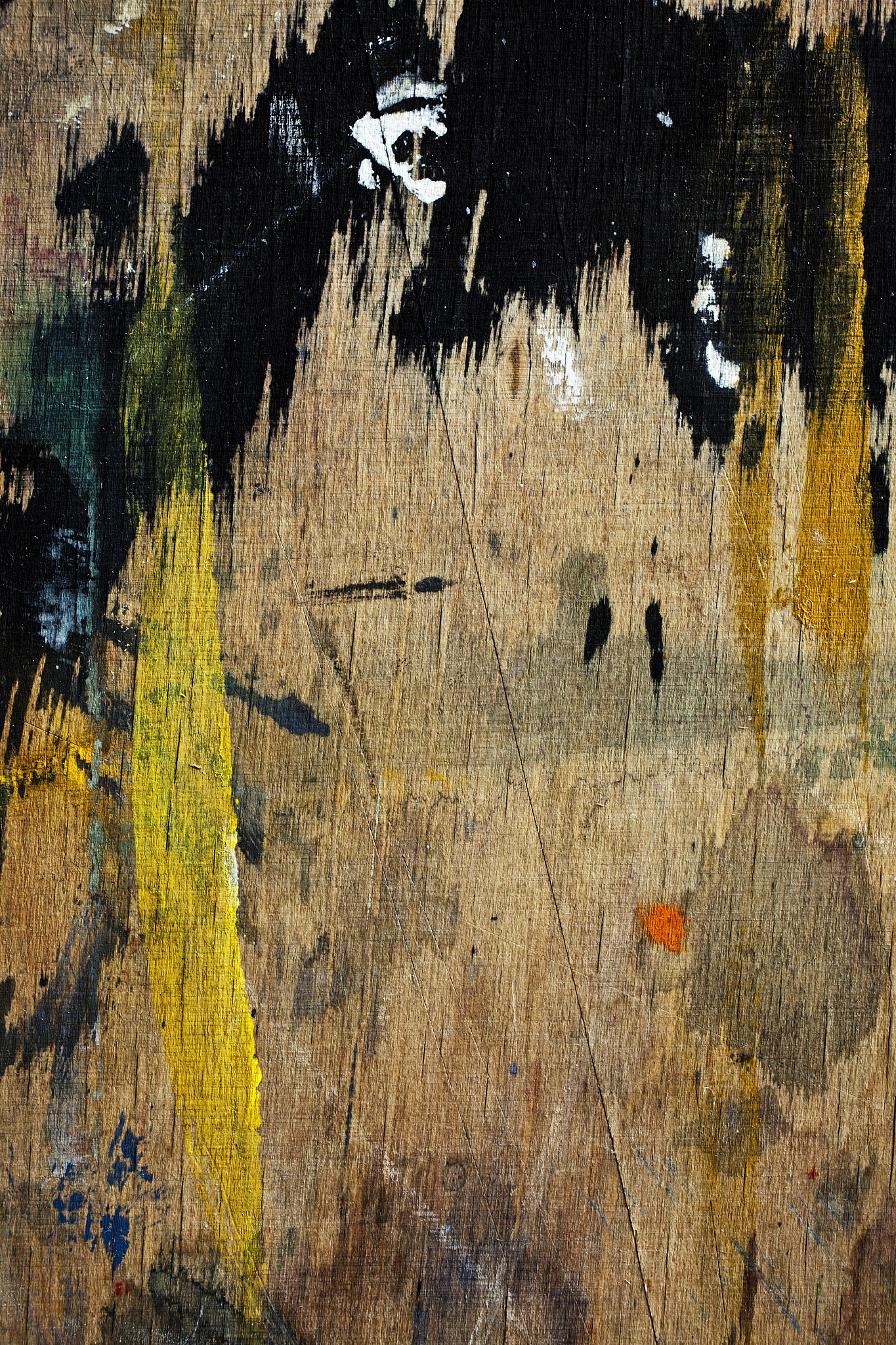 grungy wooden board with traces of paint.