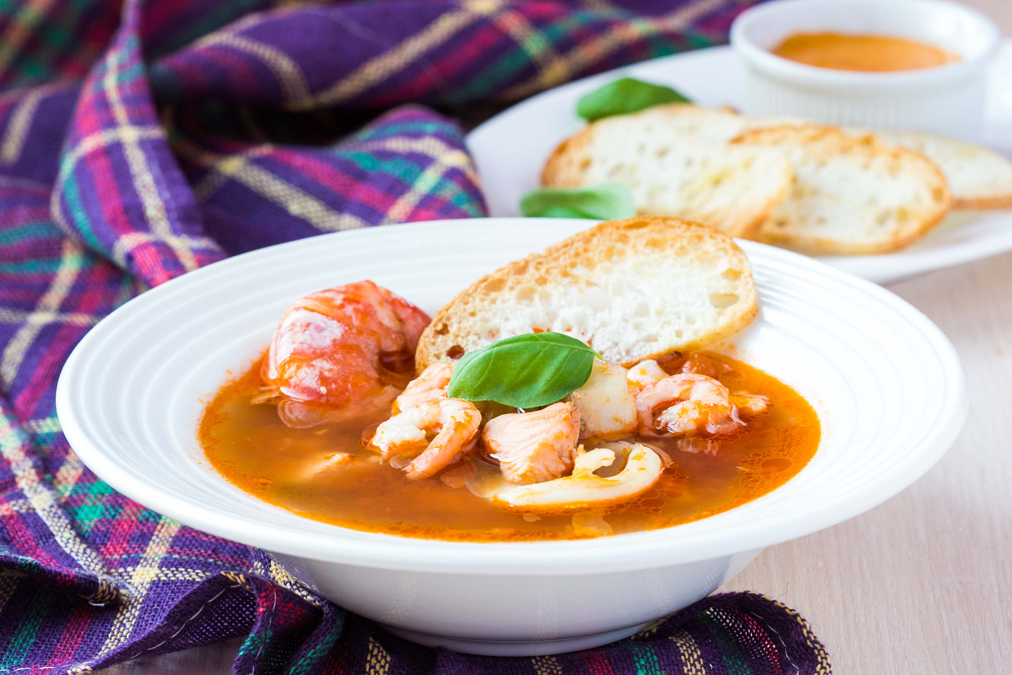 french bouillabaisse fish soup with seafood, salmon, shrimp