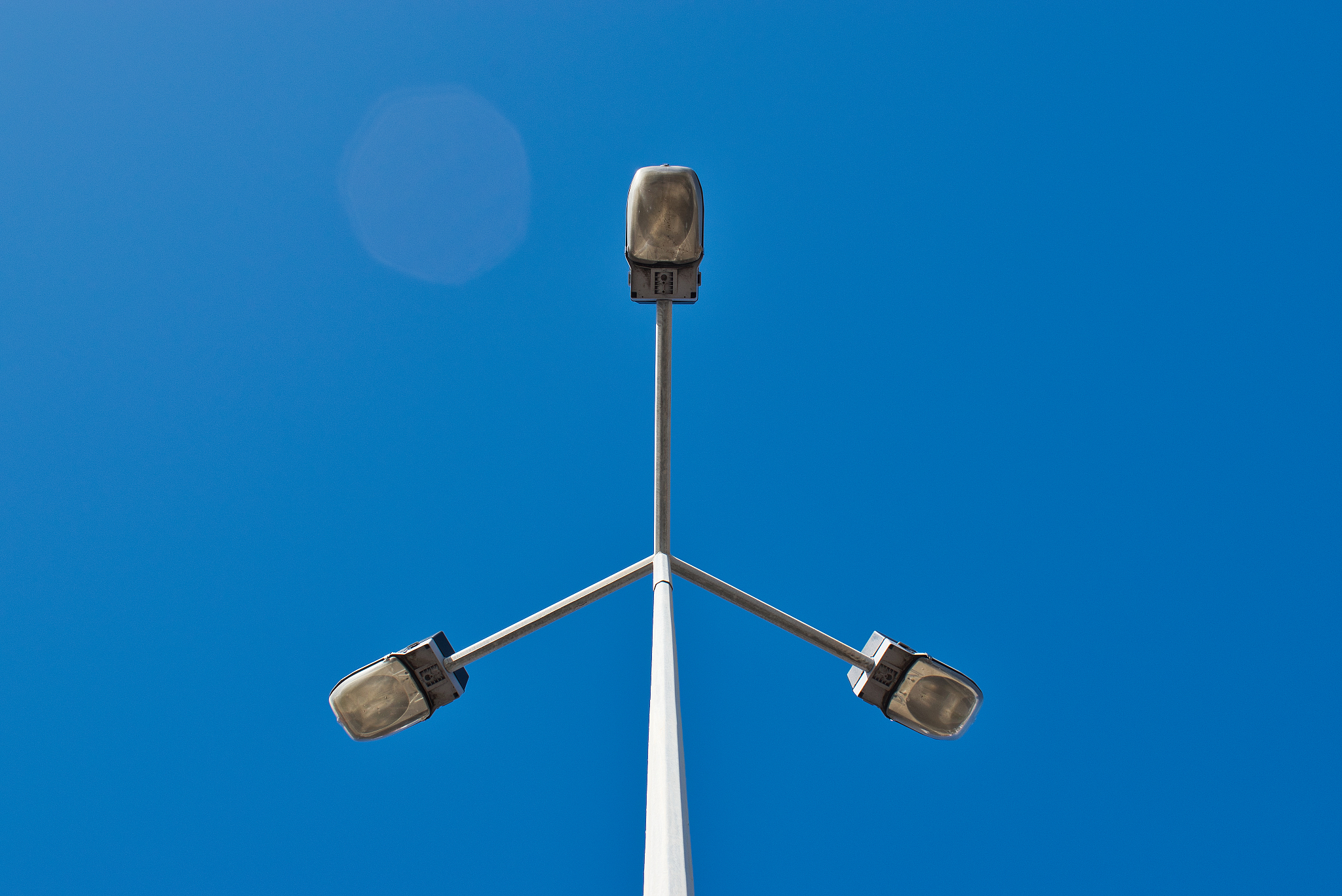 low angle view of street light against clear blue sky