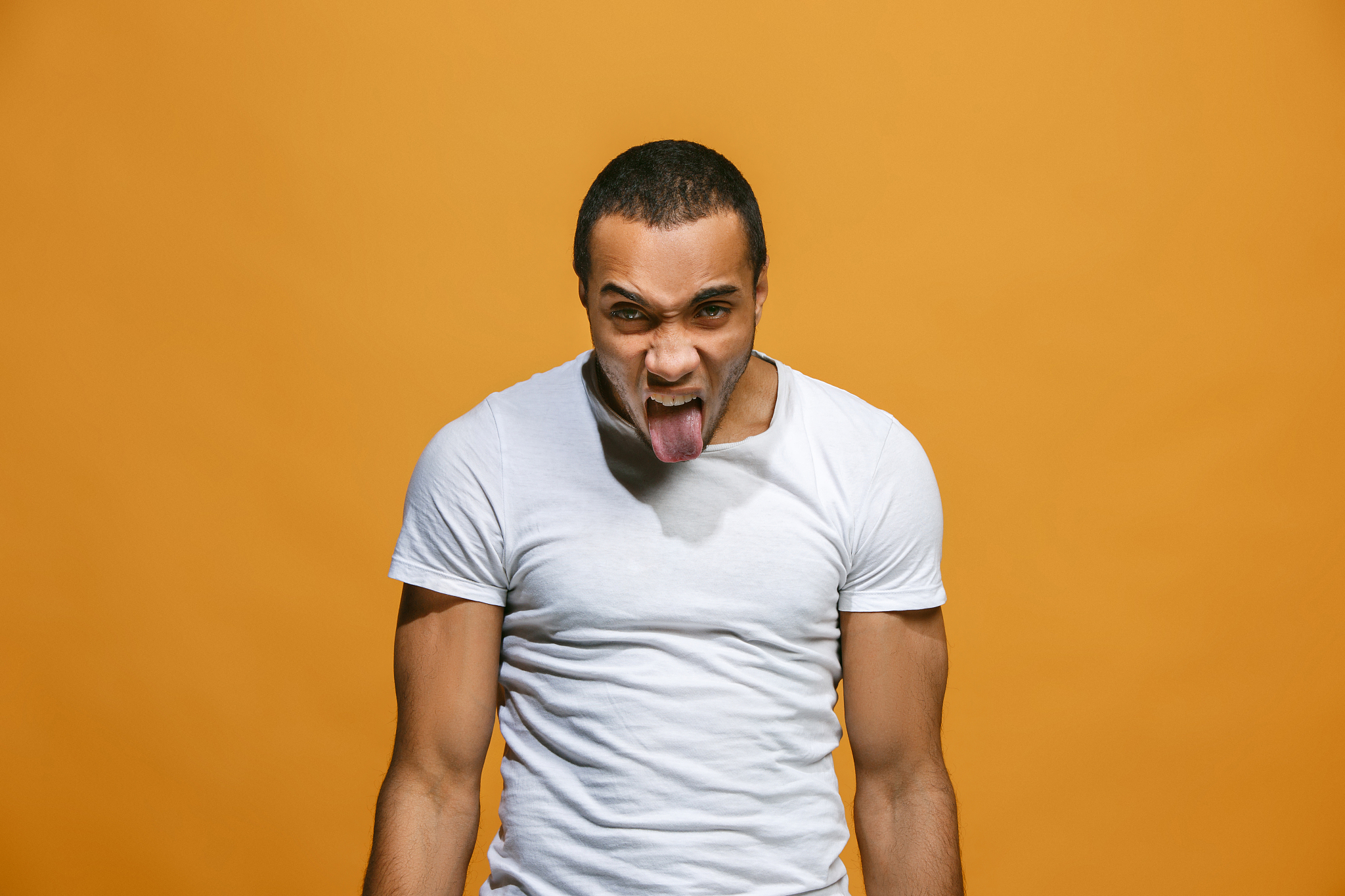 the young emotional angry and scared man standing and looking at