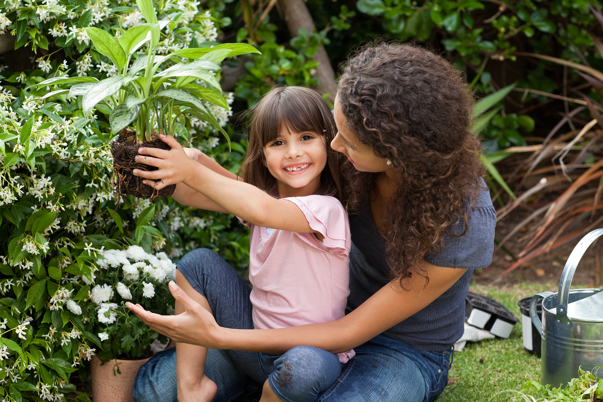 mother and daughter working in the garden