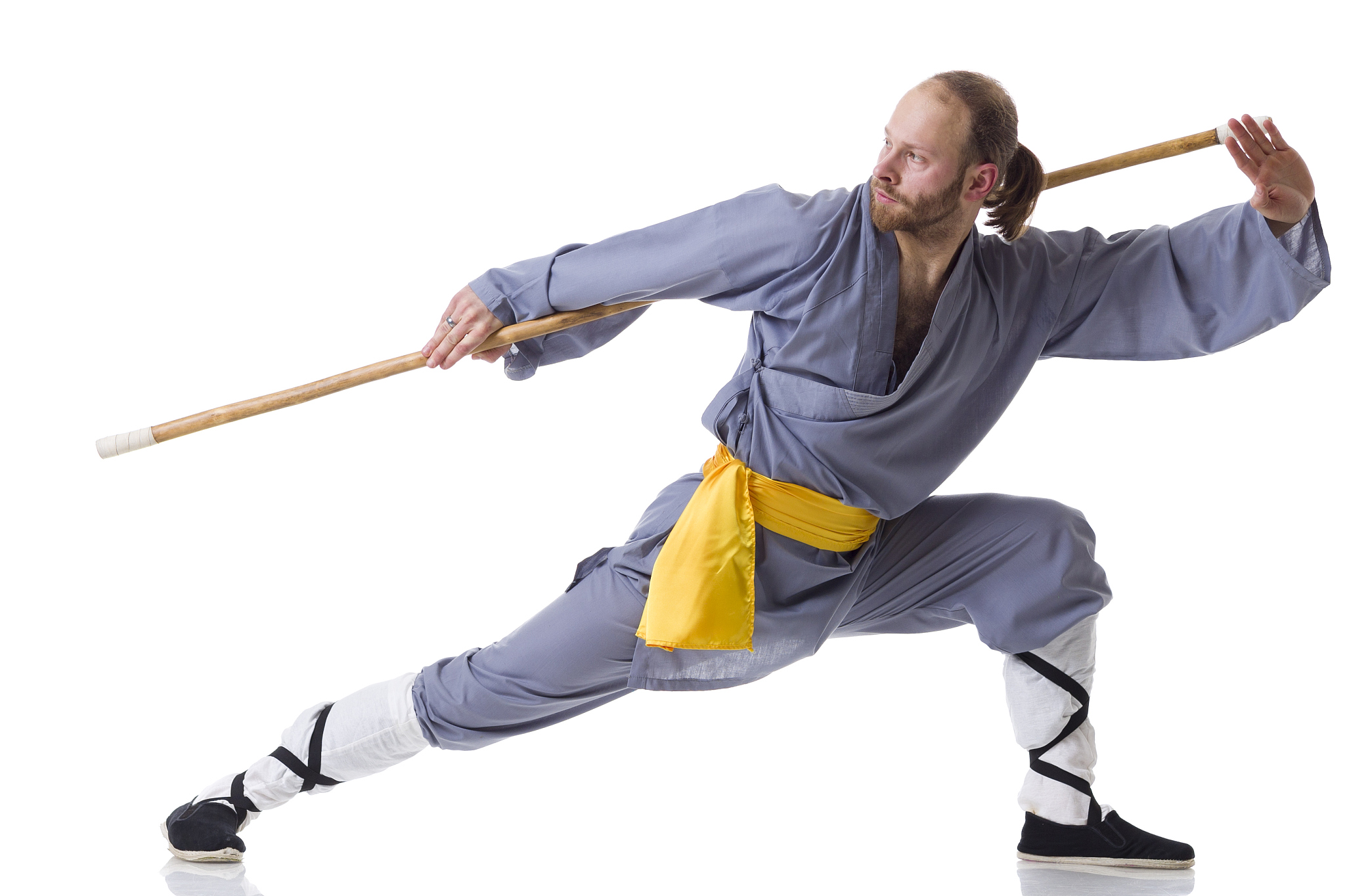 kung fu fighting position with wushu cudgel isolated on white