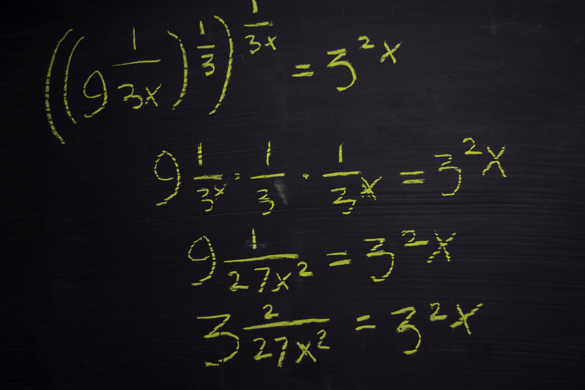 close up math formulas written on a blackboard. education concep