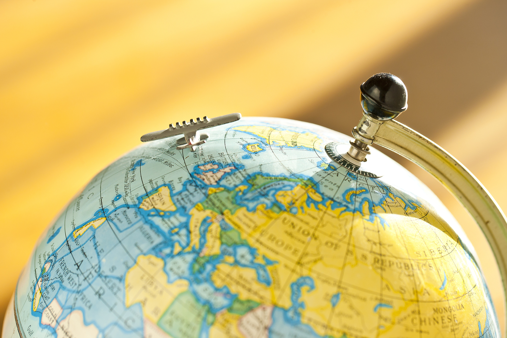 vintage globe with an antique toy model