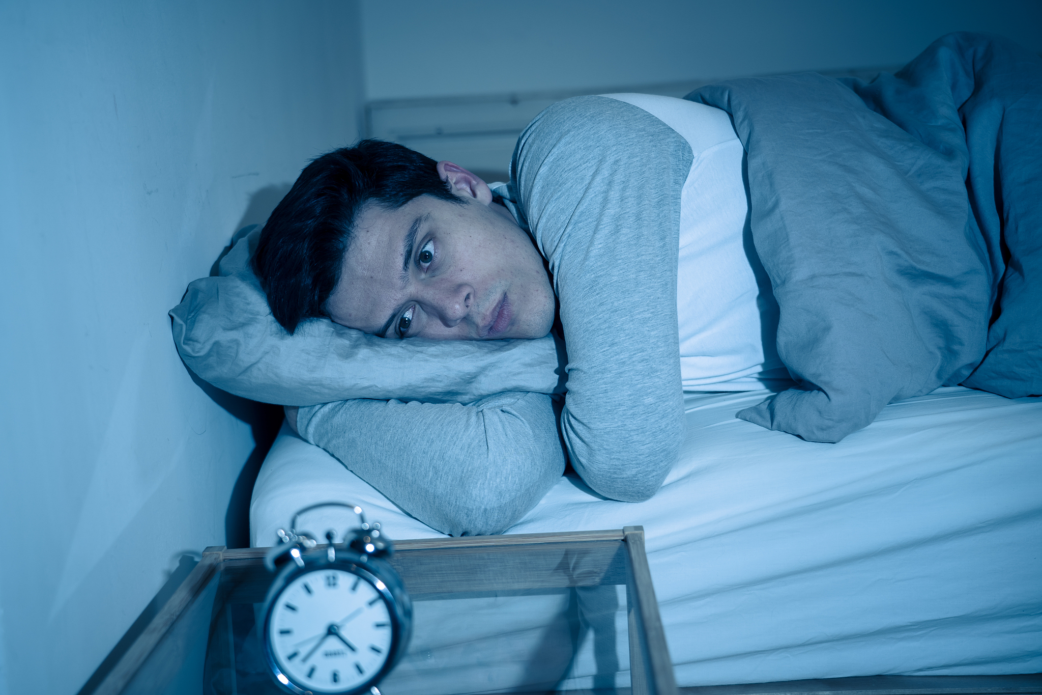 sleepless and desperate young caucasian man awake at night not a