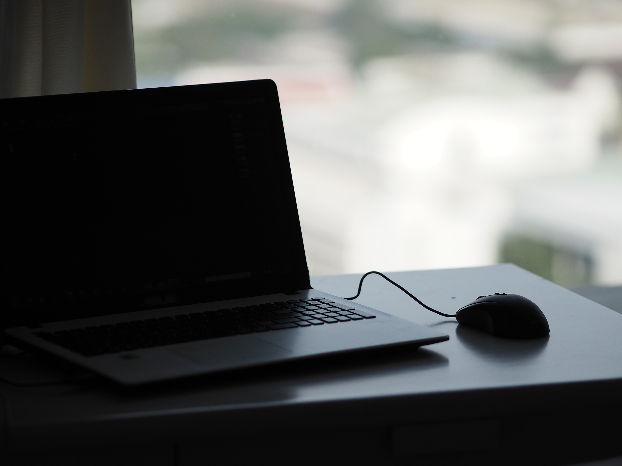 closeup one notebook and mouse on the desk working