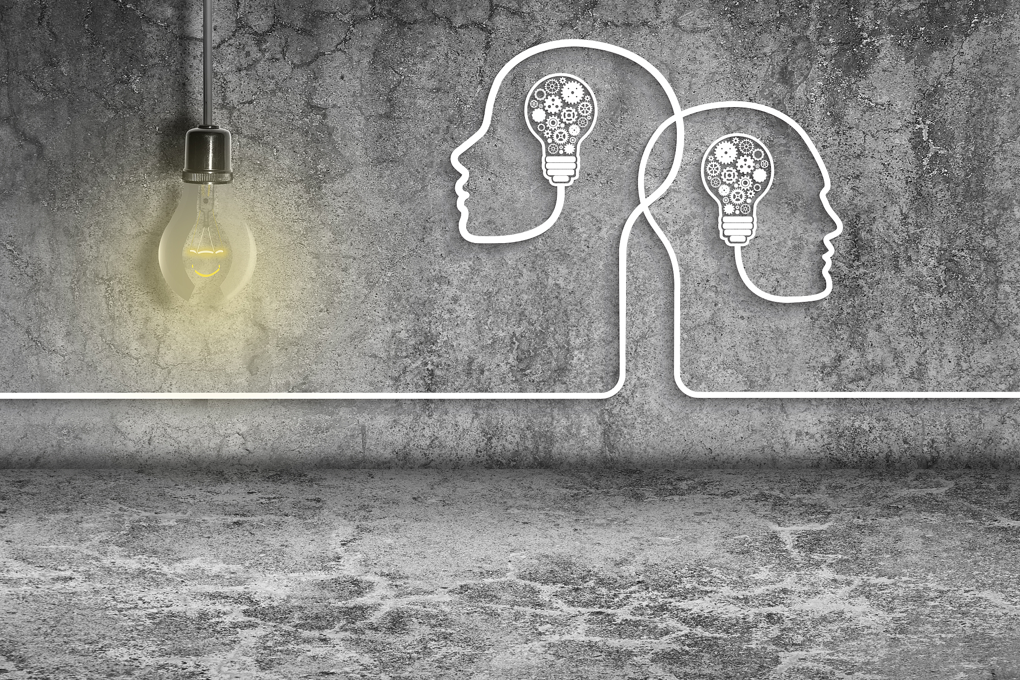 human heads with light bulbs and gears on dirty wall