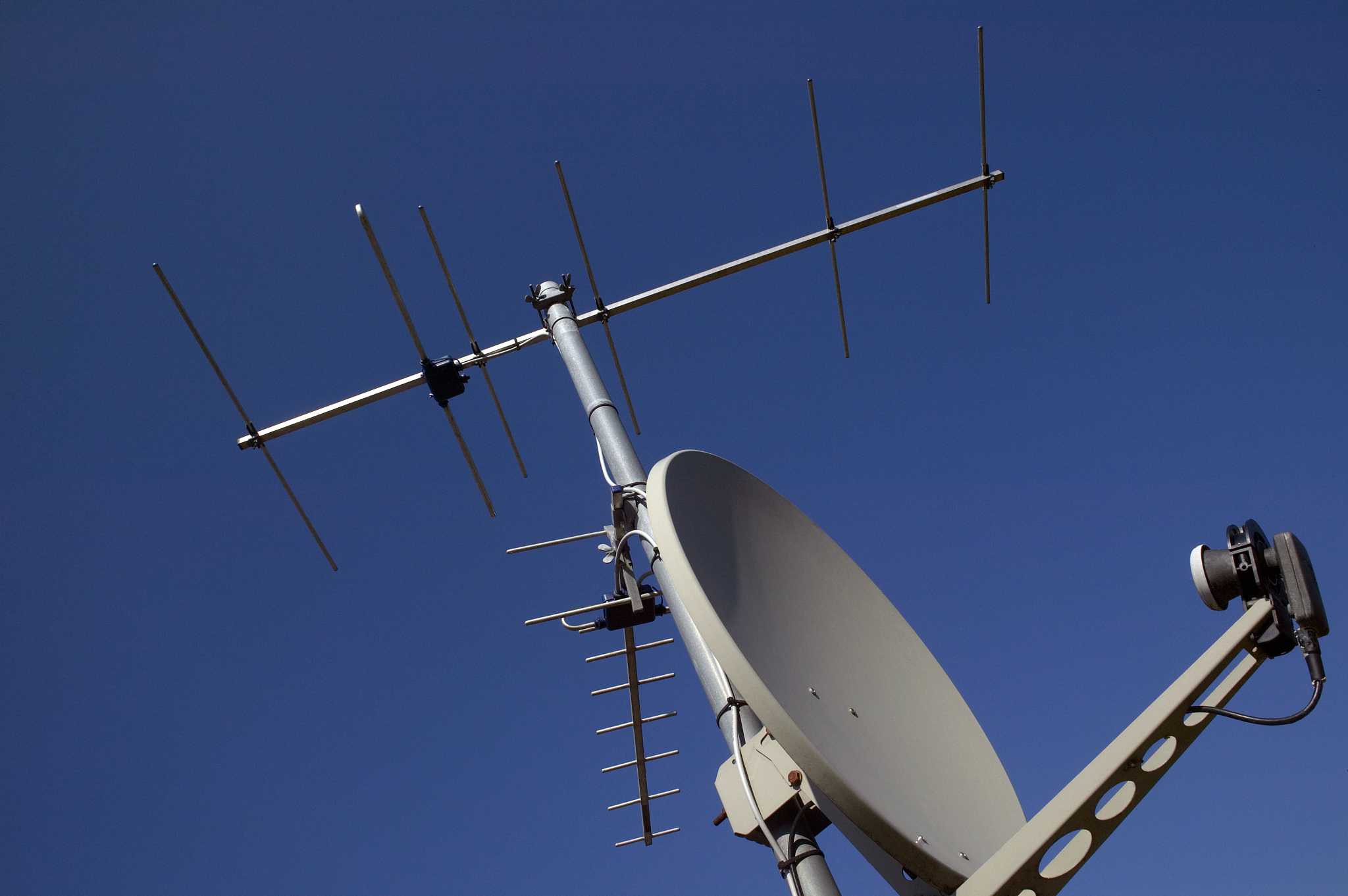 low angle view of a satellite dish against blue sky
