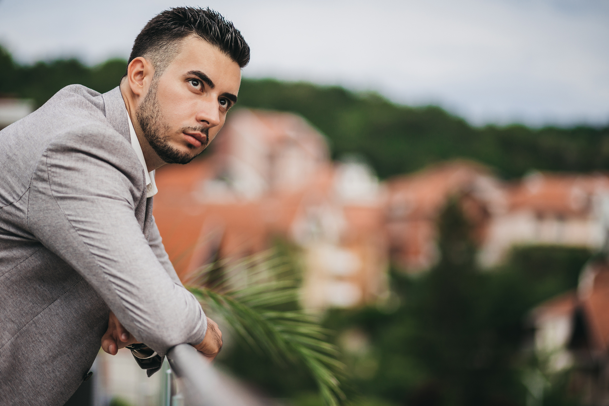 business man admiring the view from rooftop