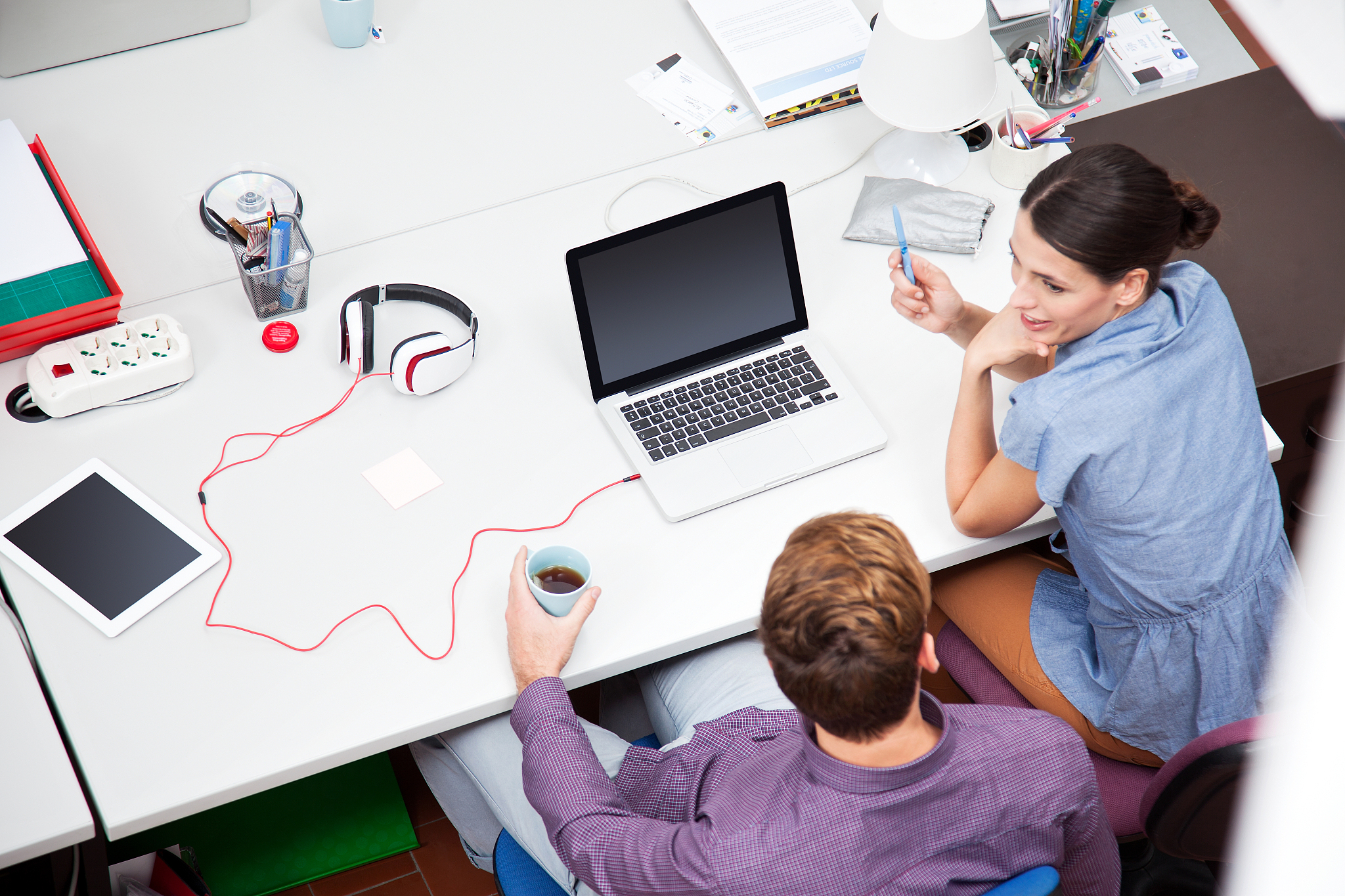 colleagues working in office, high angle