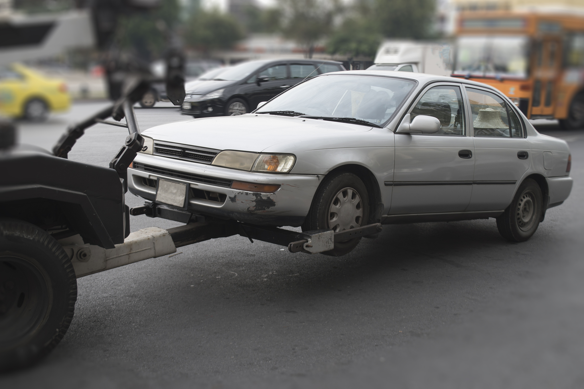 police department tow truck delivers the damaged vehicle