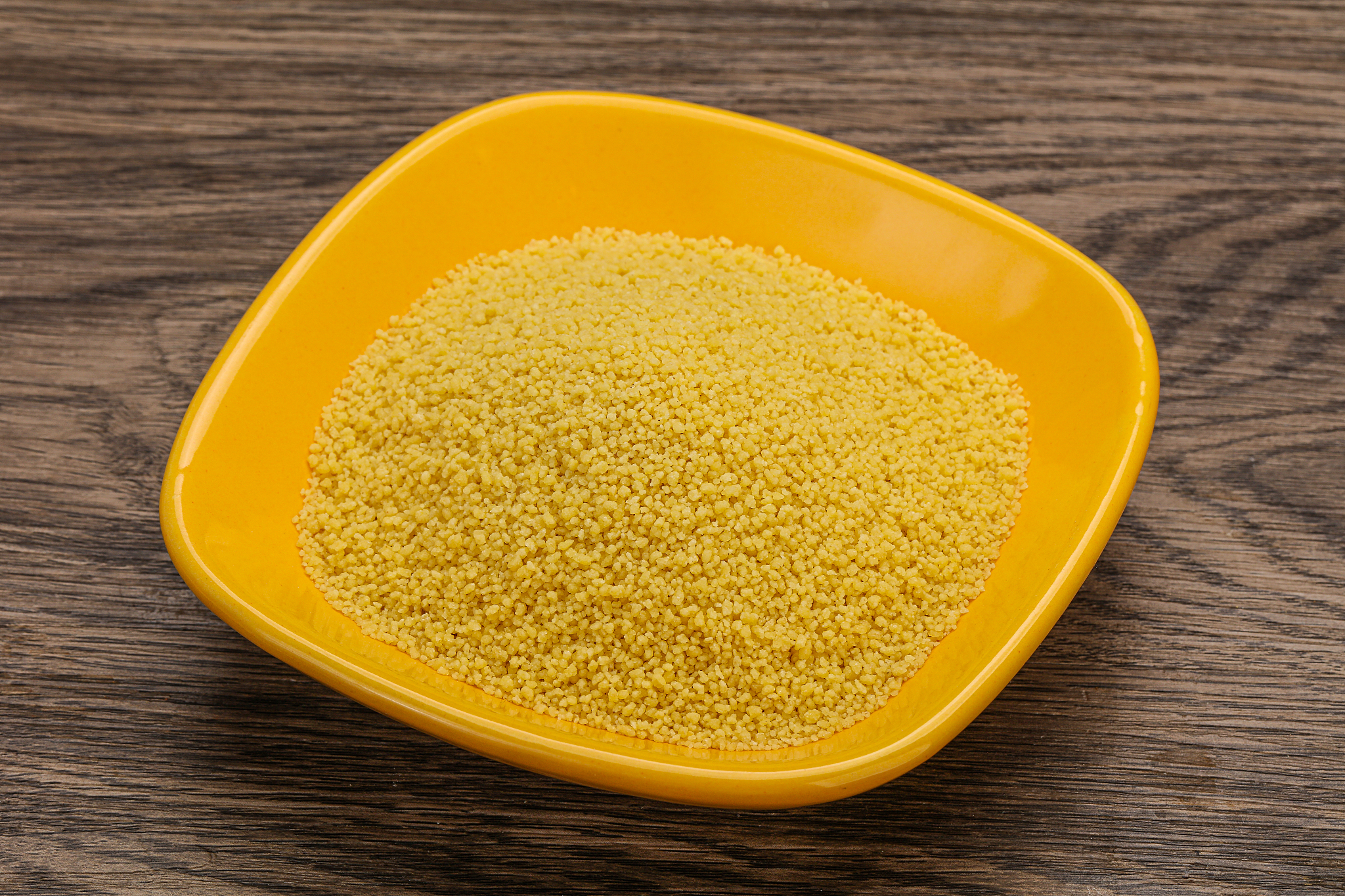 raw cous cous heap in the bowl