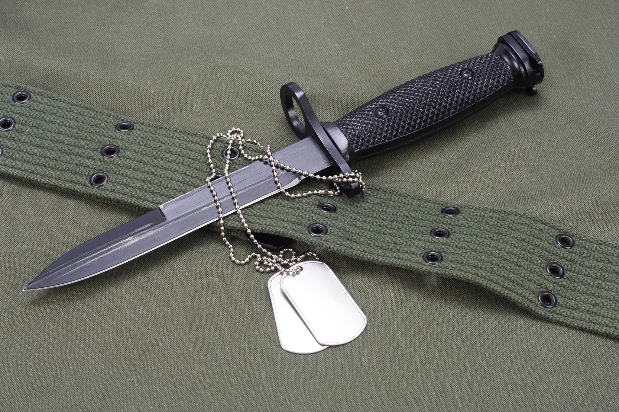 m16 rifle bayonet on uniform background