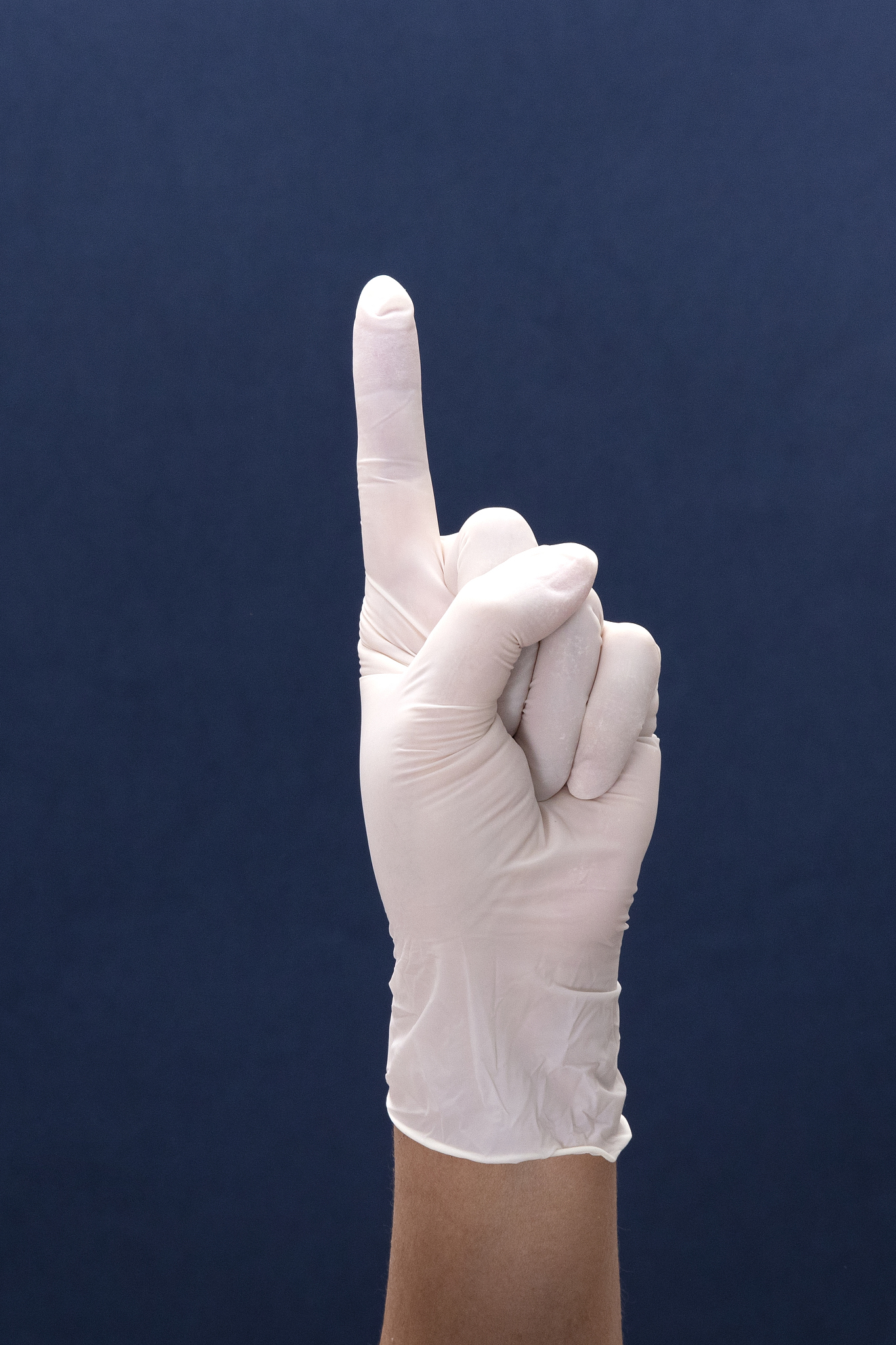 doctor hand with white medical glove showing number one with fin