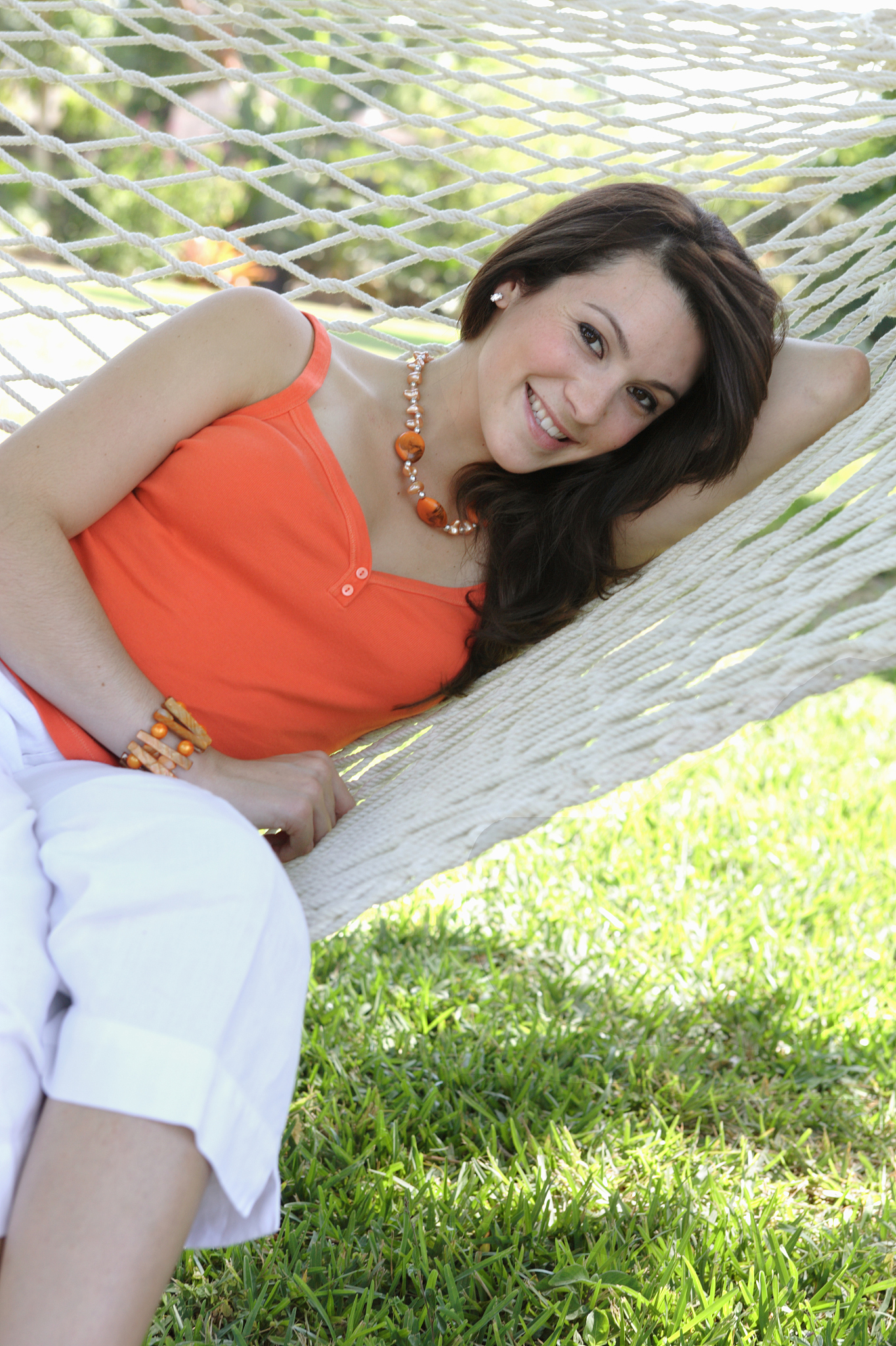smiling girl lying in a hammock, portrait
