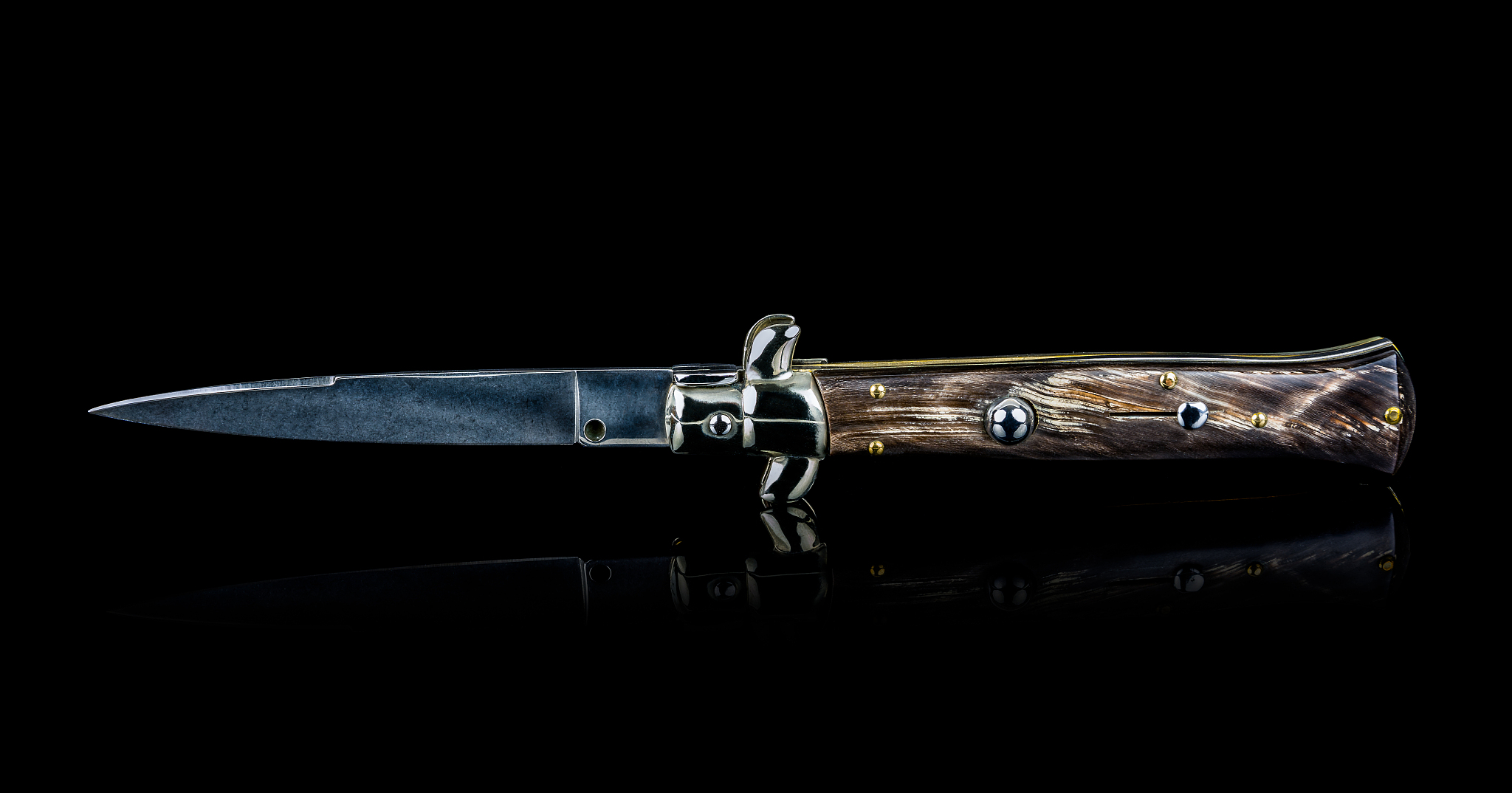 beautiful handmade italian switch blade knife isolated on black 