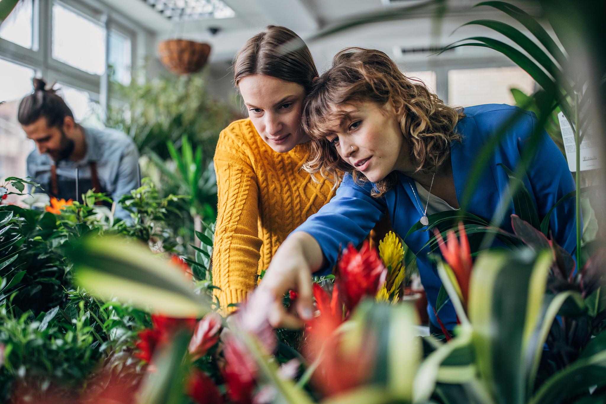 women looking flowers at the flower shop