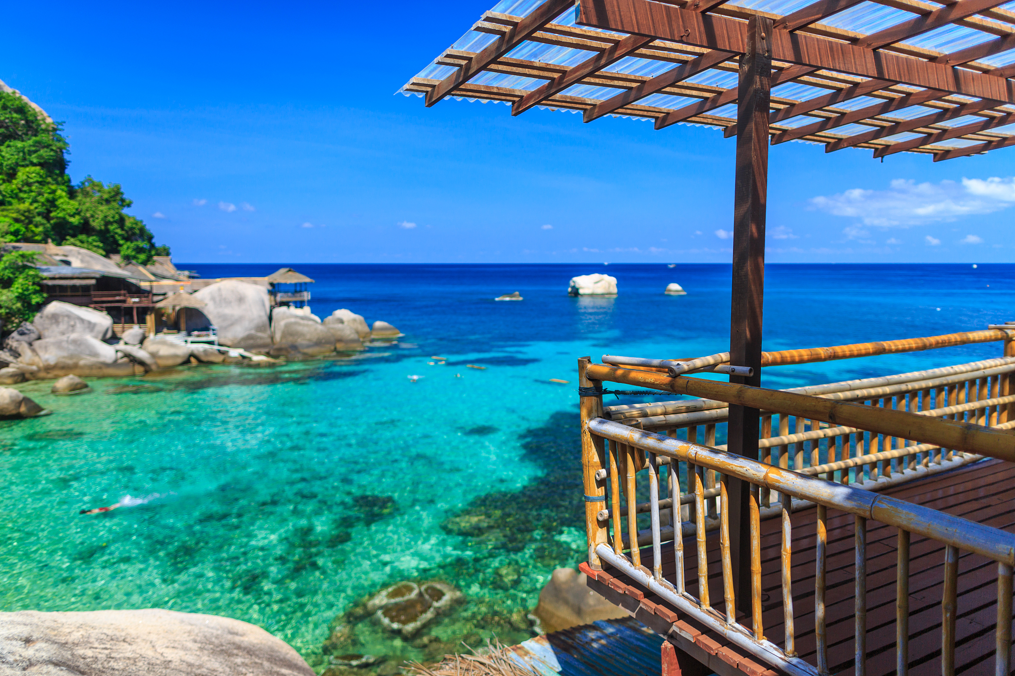 bamboo hut over crystal clear sea