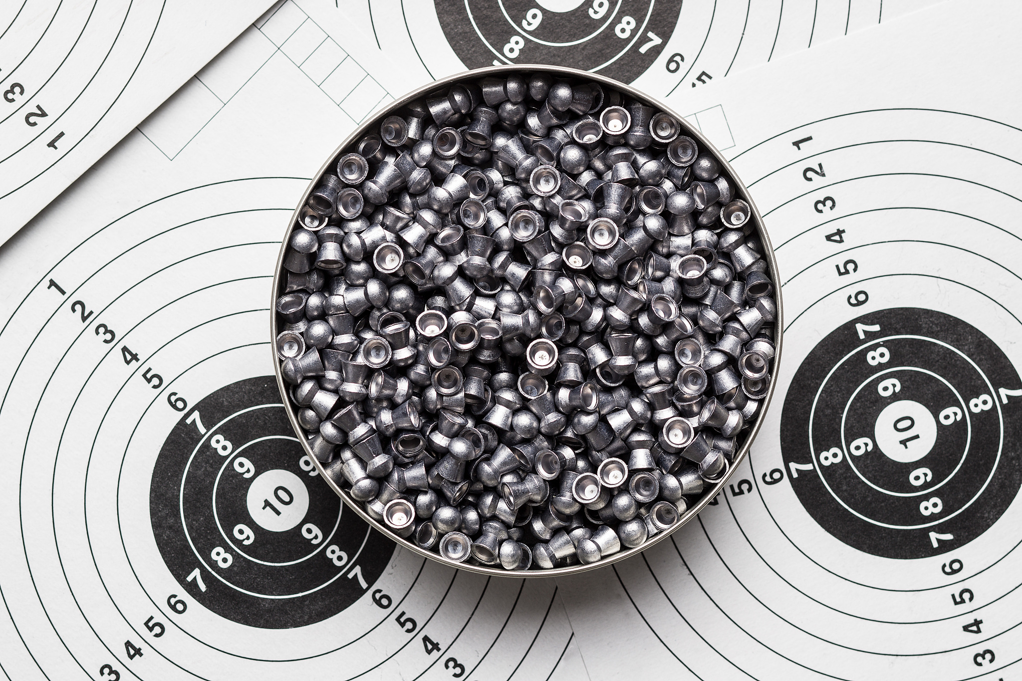 lead airgun pellets on paper target.