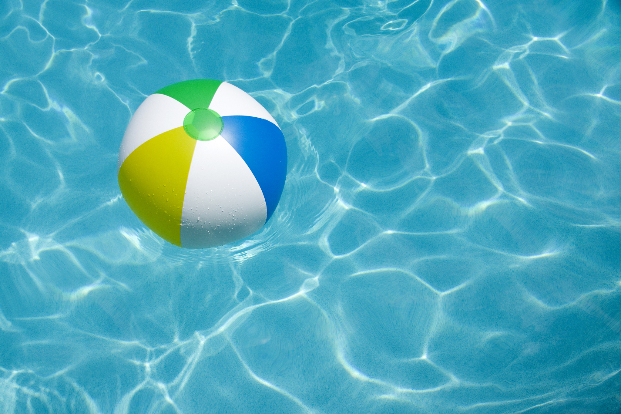 beach ball floating in pool