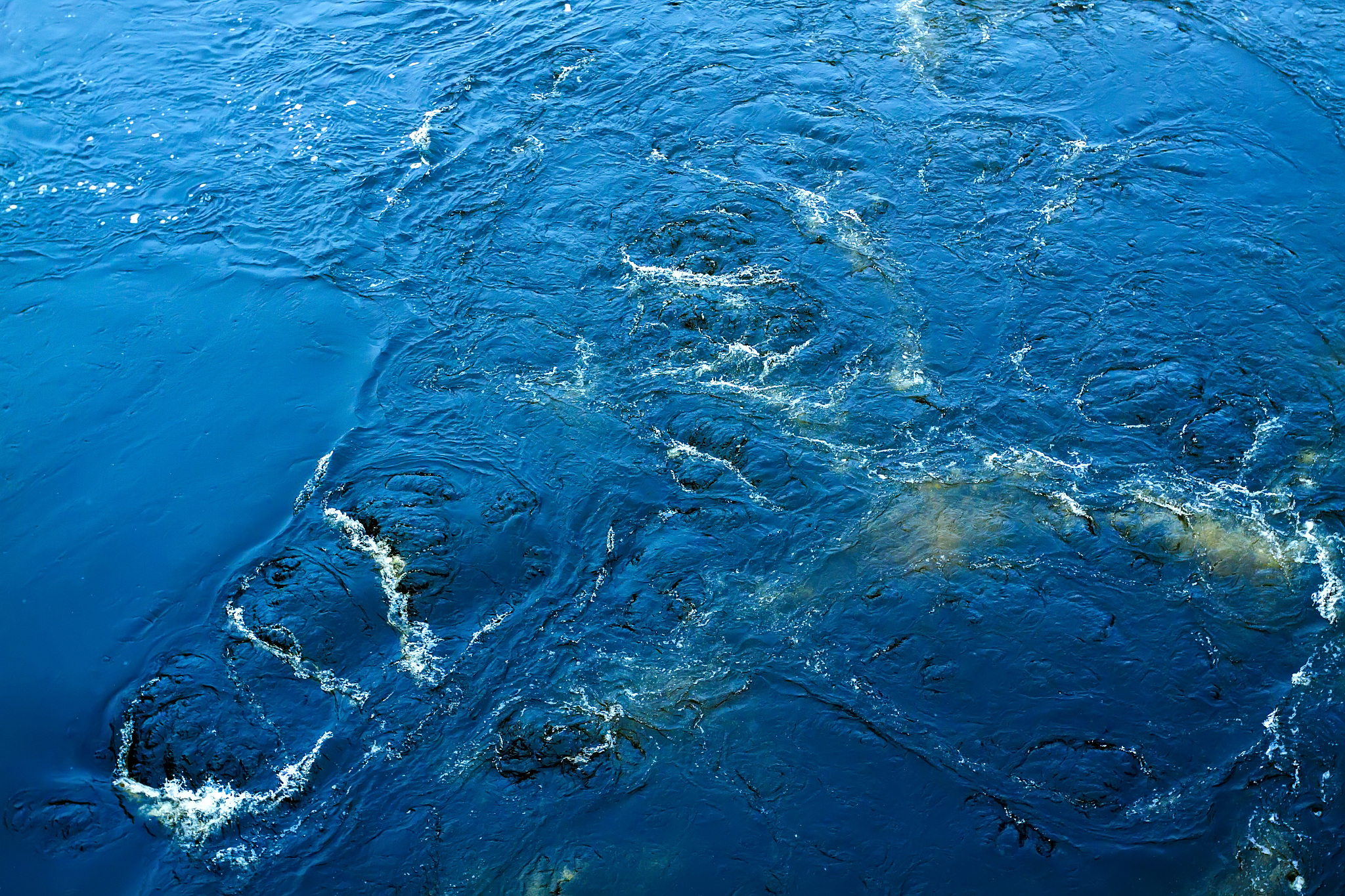 the raging waters of the pacific ocean with foamy waves and wate