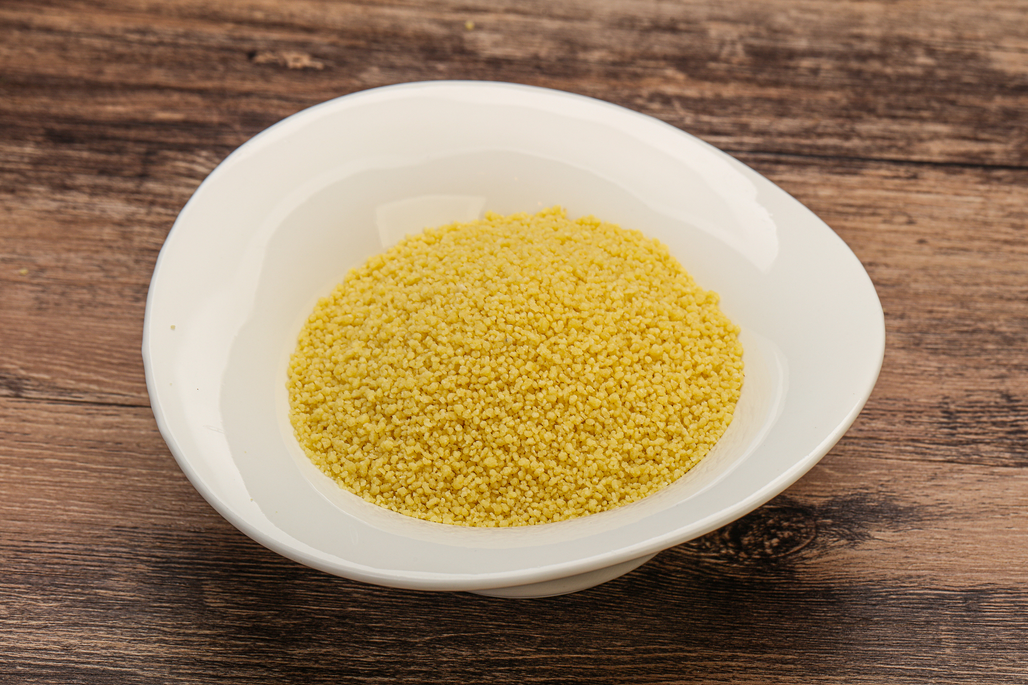 raw cous cous heap in the bowl