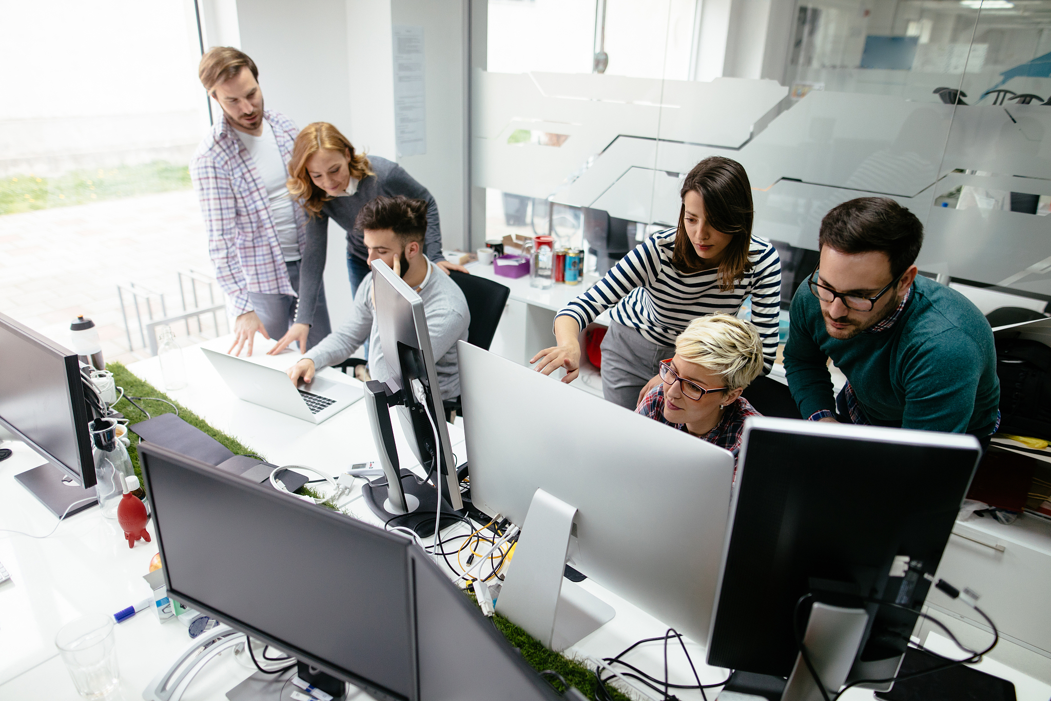 web designers working in office on project together