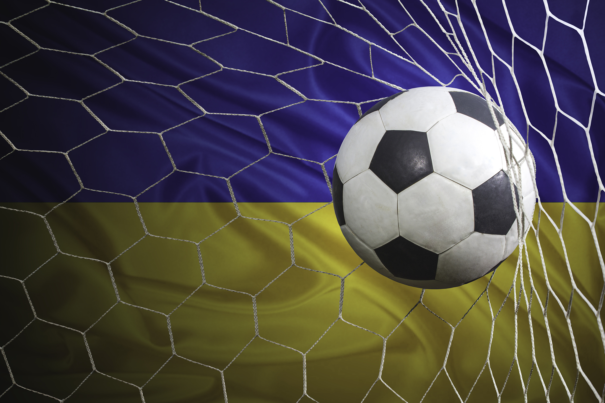 ukraine flag and soccer ball, football in goal net