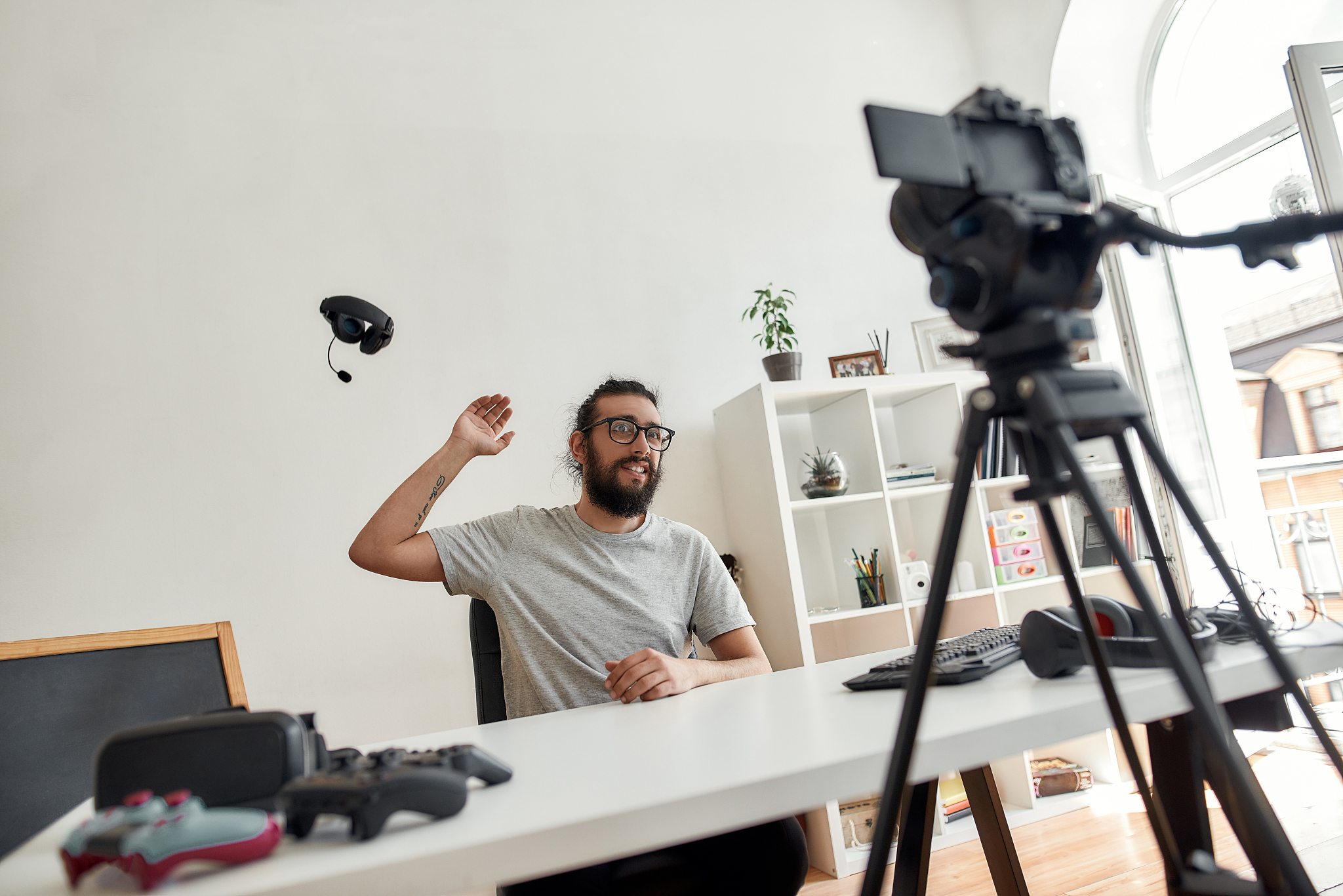 male technology blogger throwing away headphones, dissatisfied w