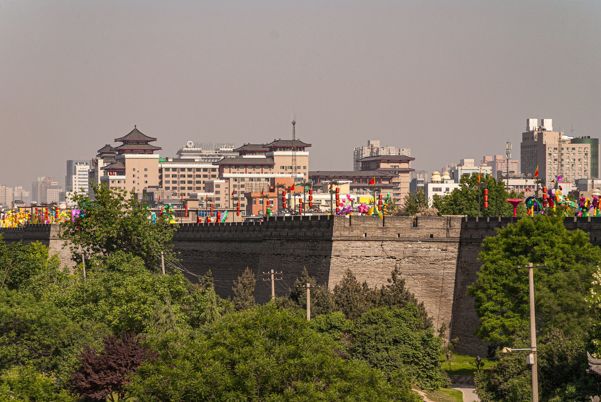 rampart and cityscape at huancheng city wall, xian, china.