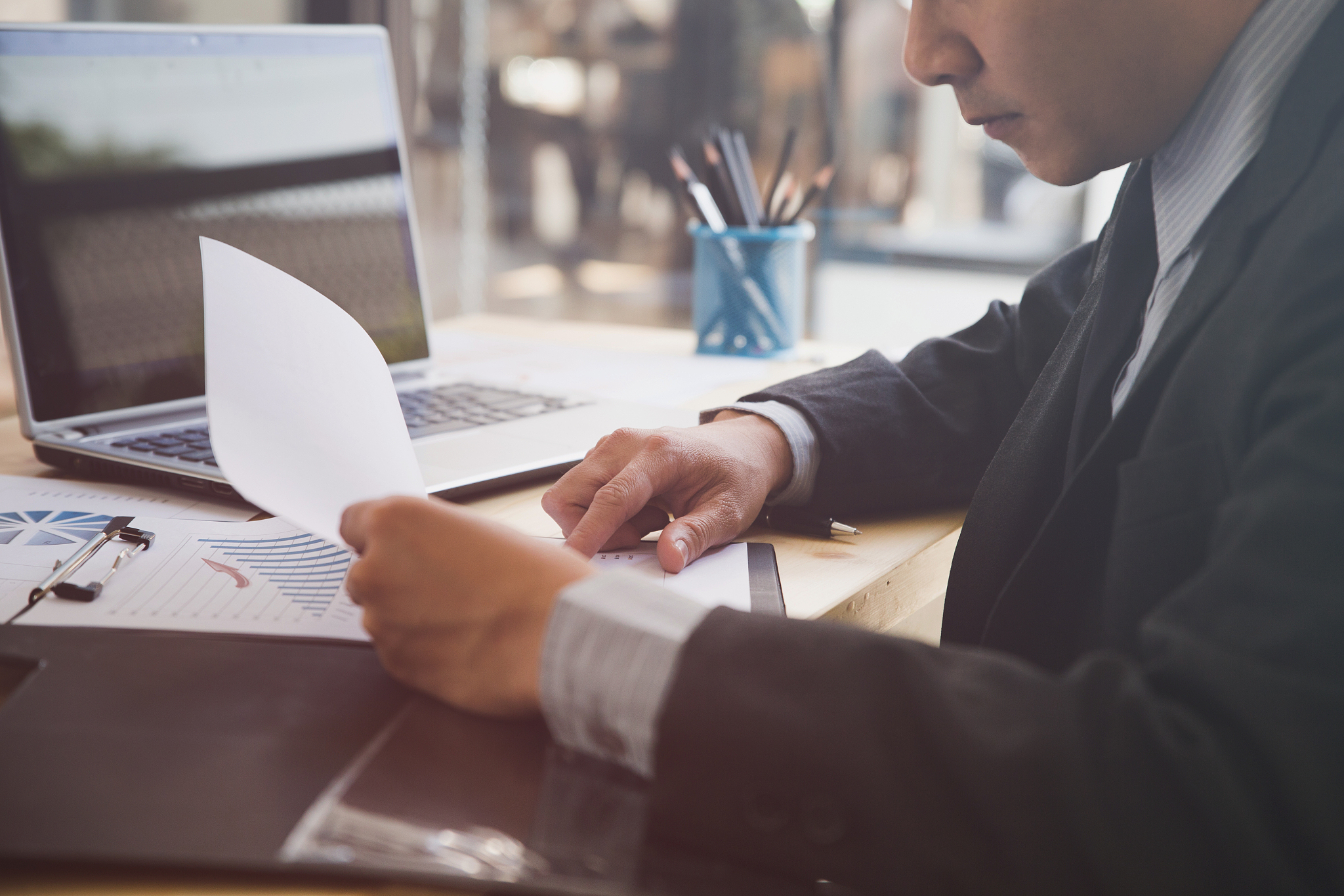 midsection of man working on table