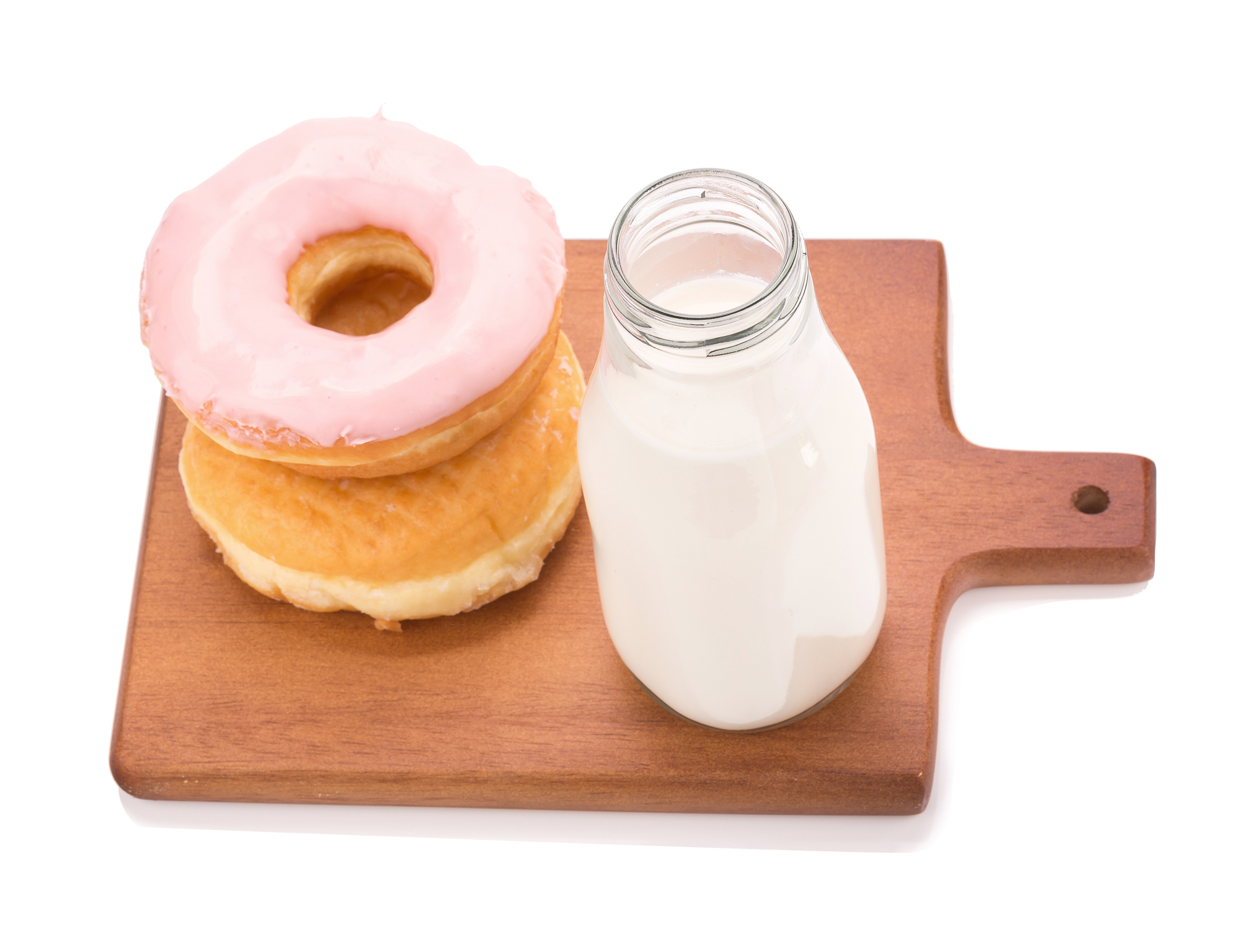 milk bottle and donut on white background