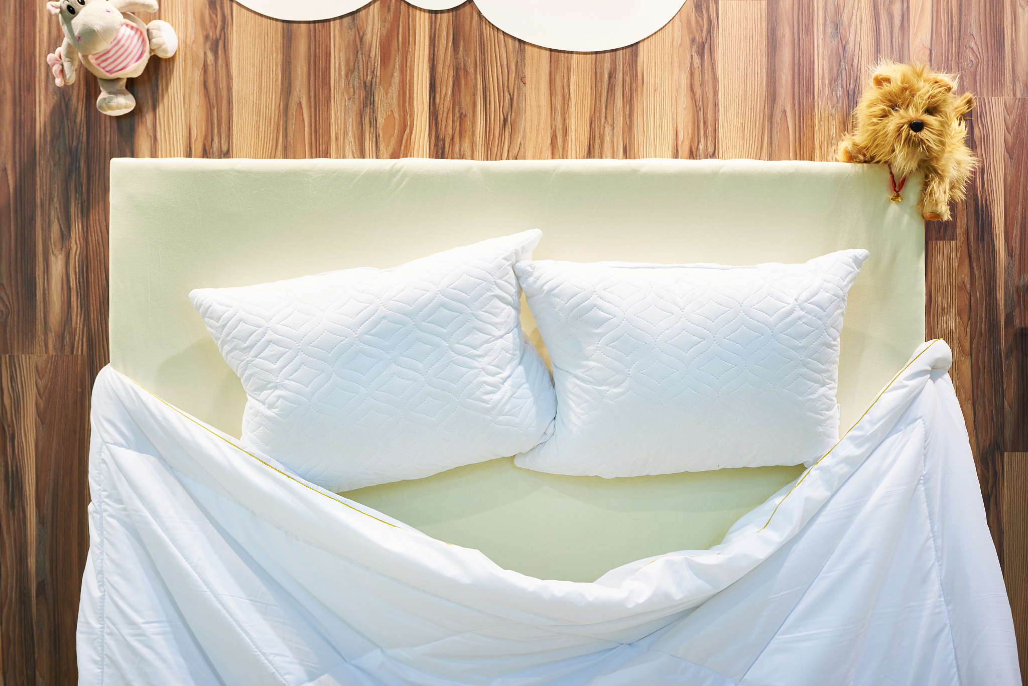 pillows and blanket on bed