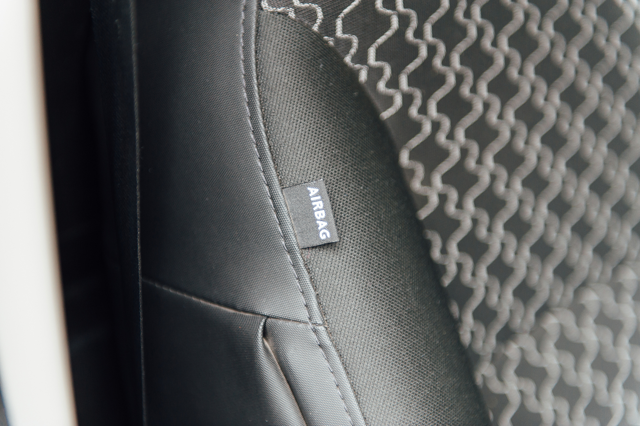 interior of a modern white car with airbag