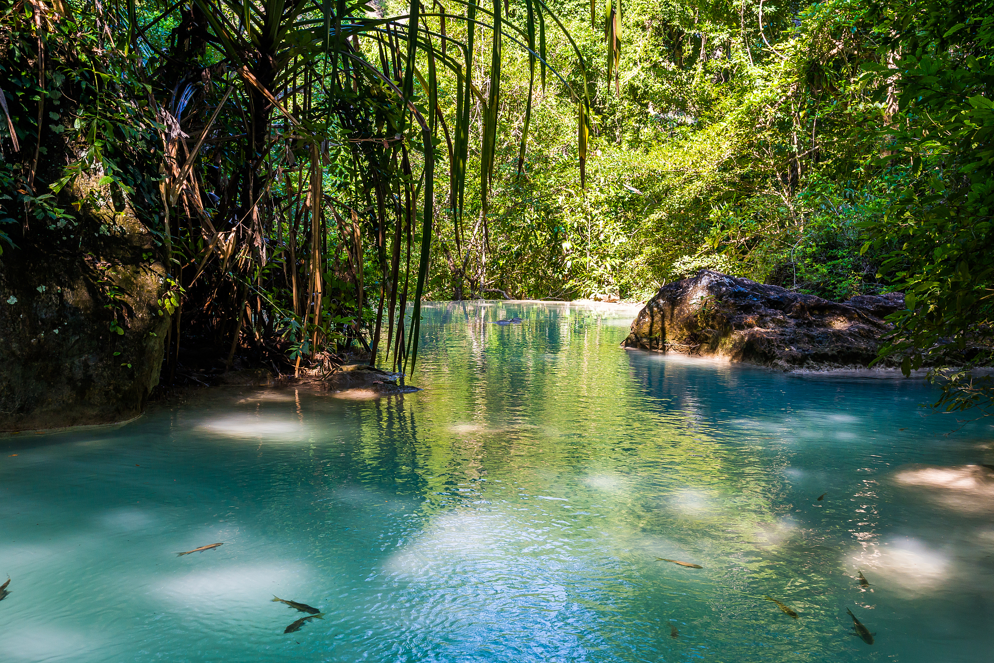 waterfall and blue emerald water color in erawan national park.