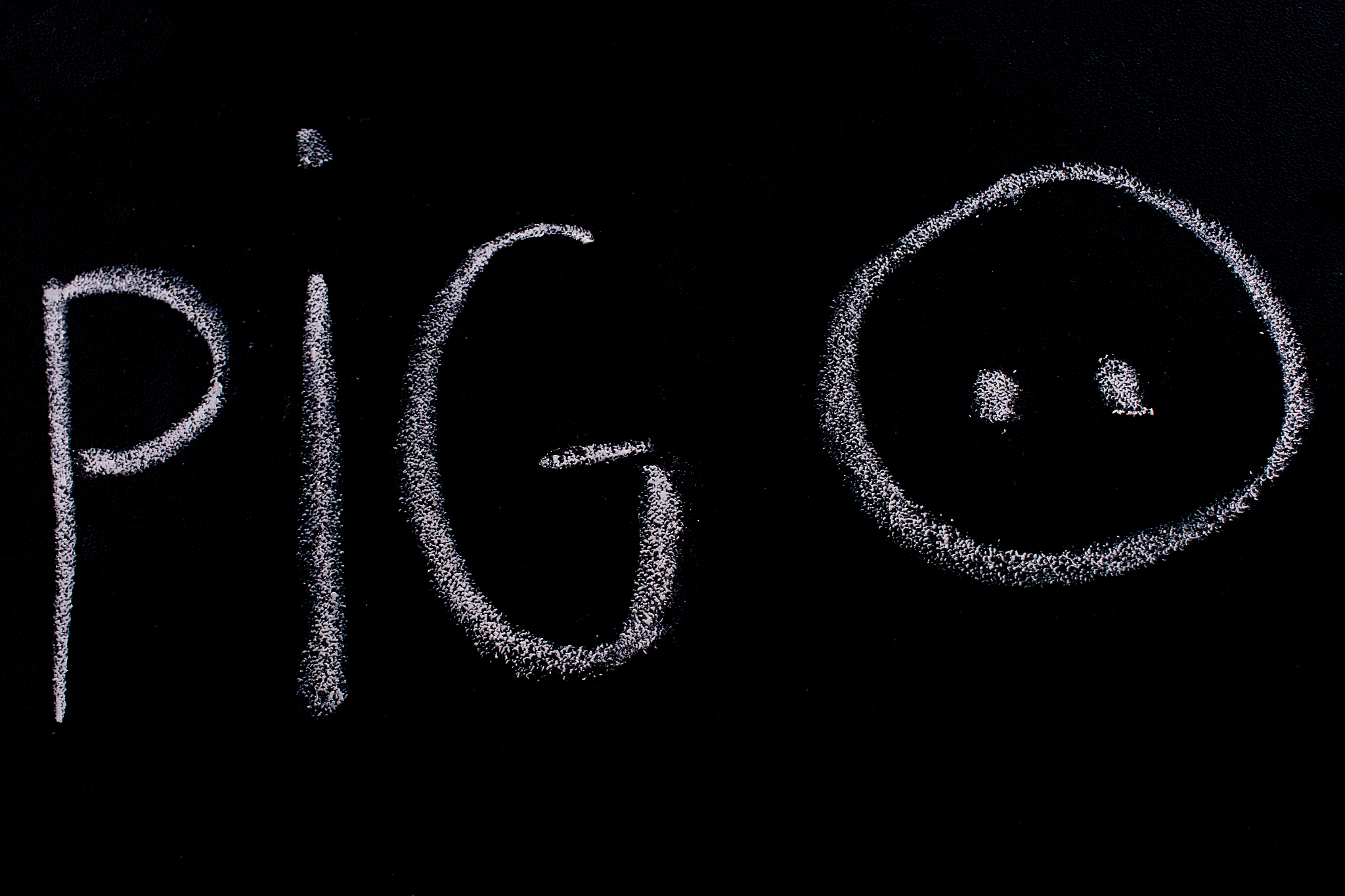 pig sign drawn on blackboard with chalk