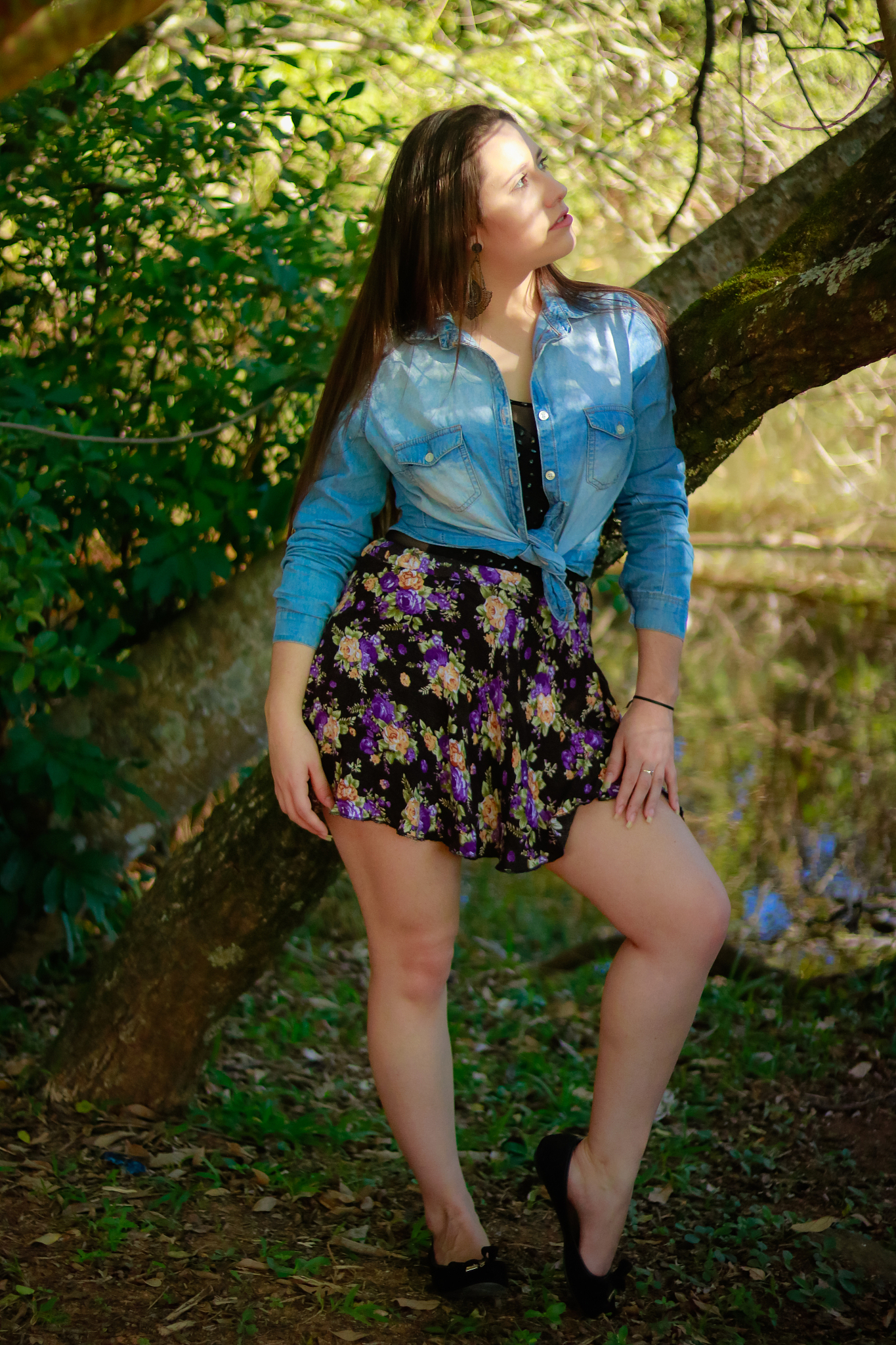 full length of woman standing against tree