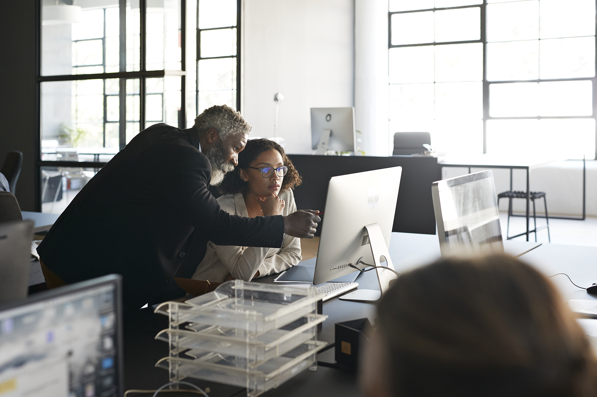 professionals discussing in modern office