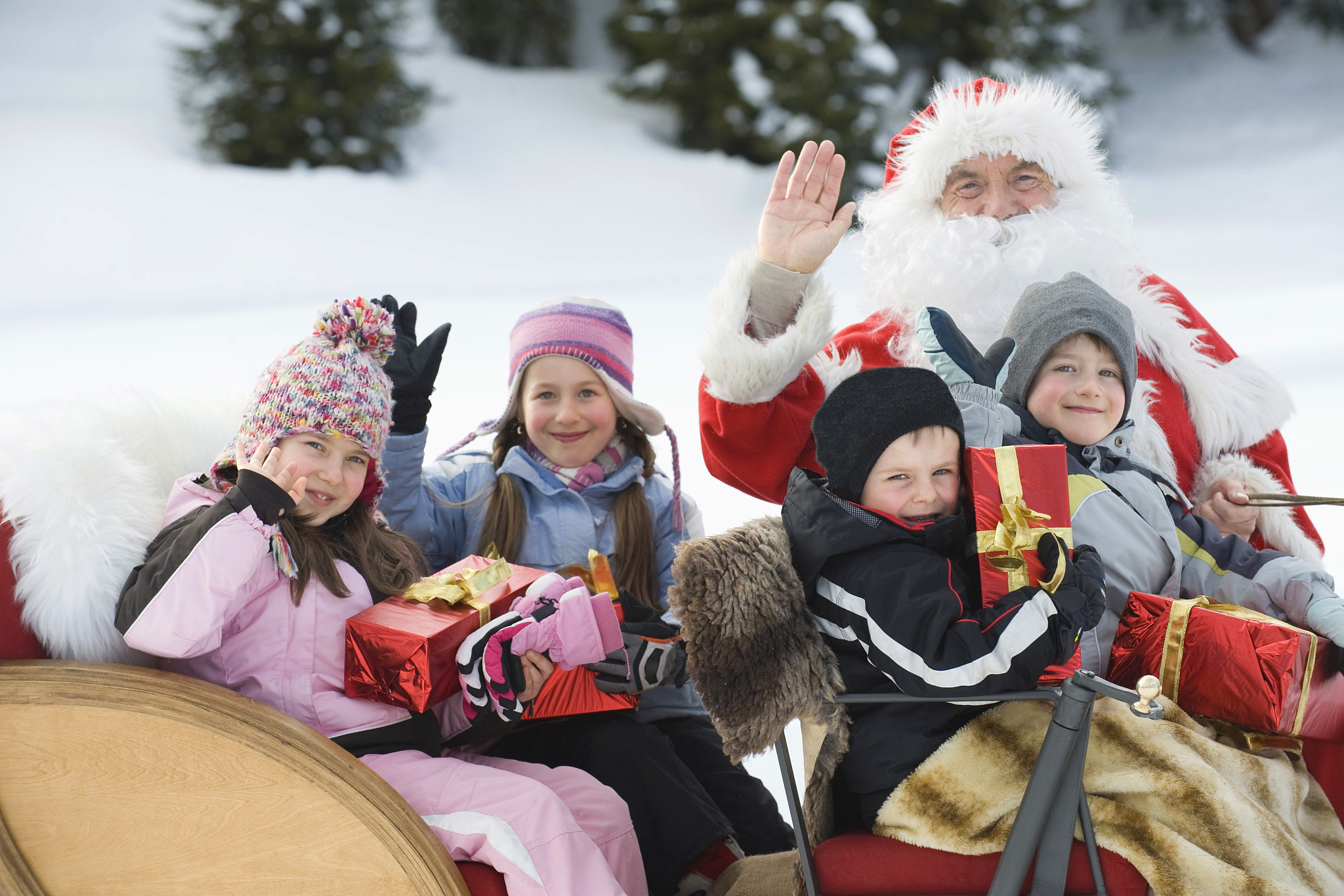 italy, south tyrol, seiseralm, santa claus and children taking a