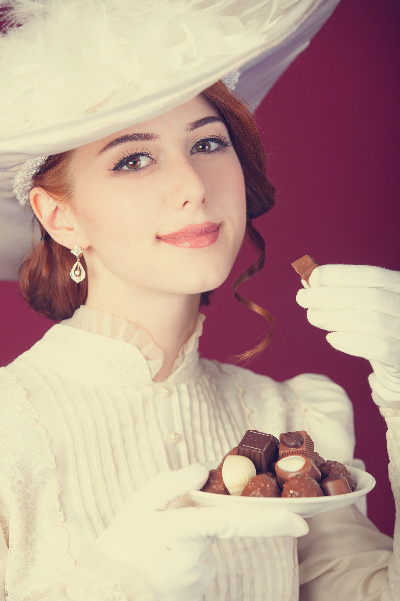 beautiful redhead women with candy.