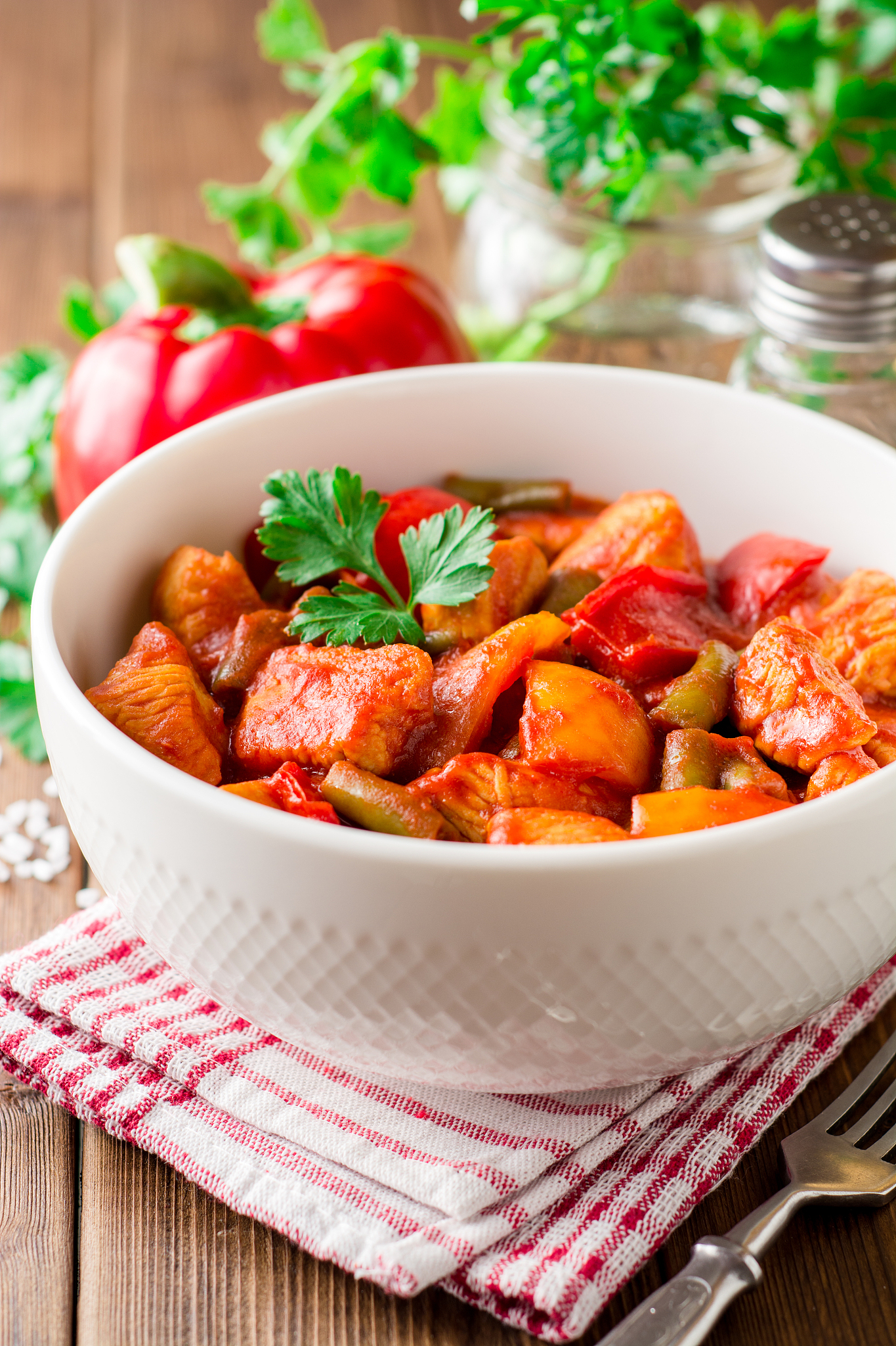 turkey stew with bell peppers, green beans and tomatoes in bowl 