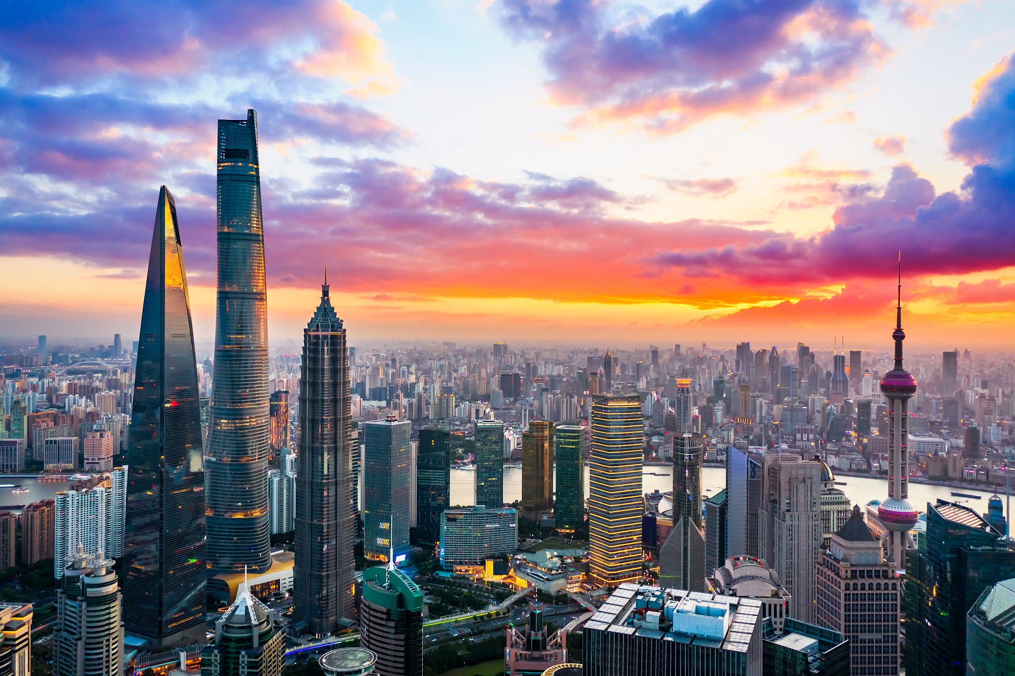 aerial view of shanghai skyline and cityscape at sunset.