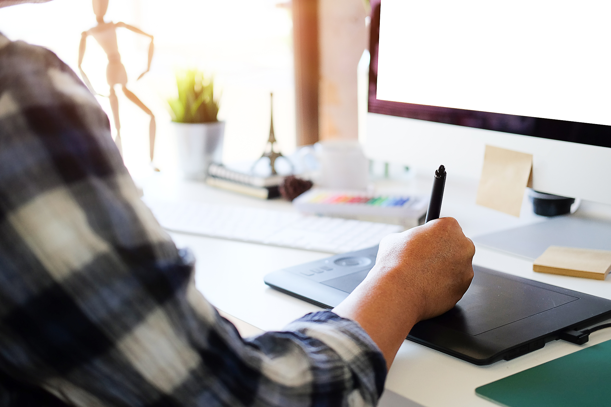 cropped image of woman using computer on table