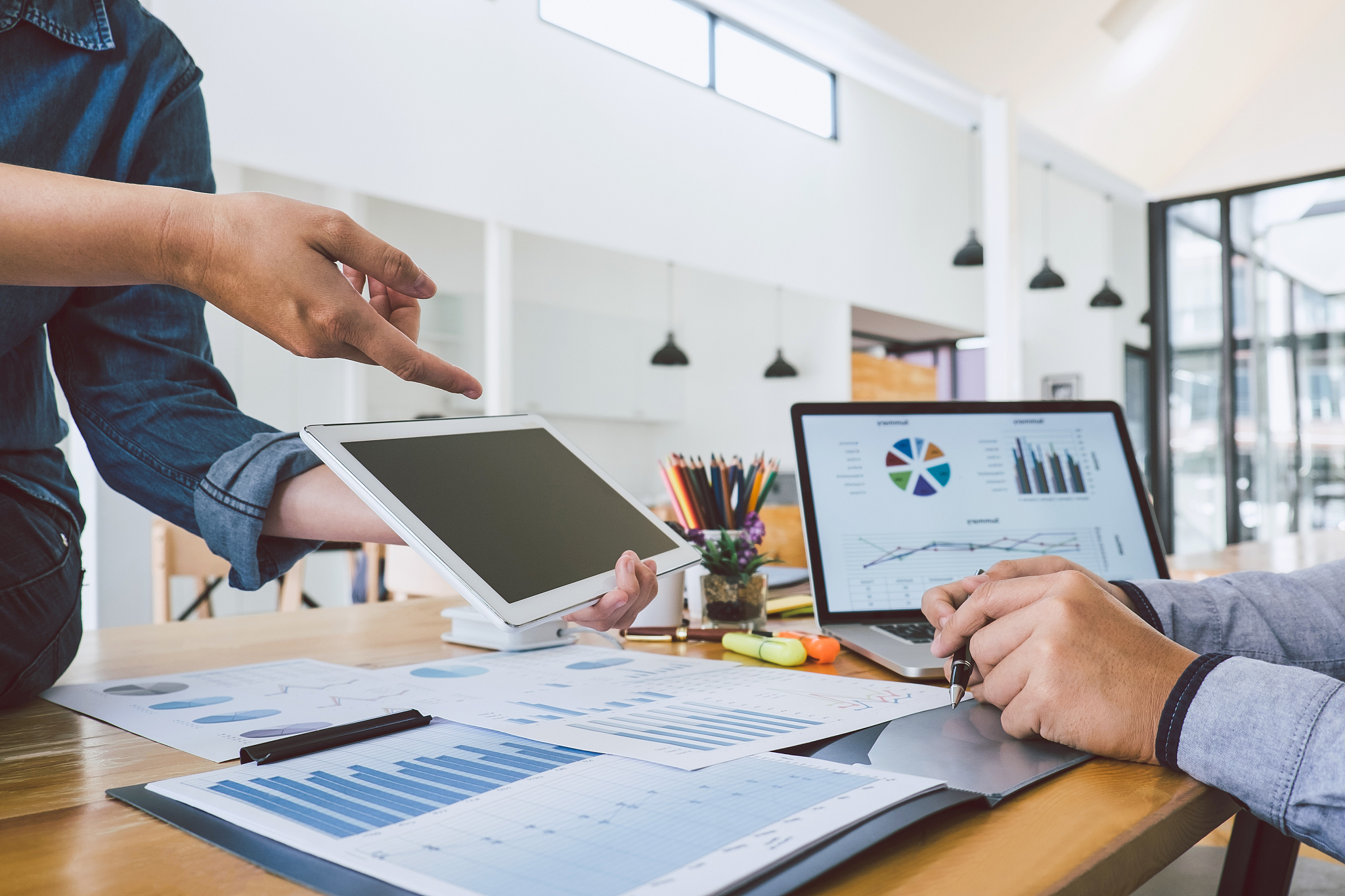 businessman pointing at digital tablet in office