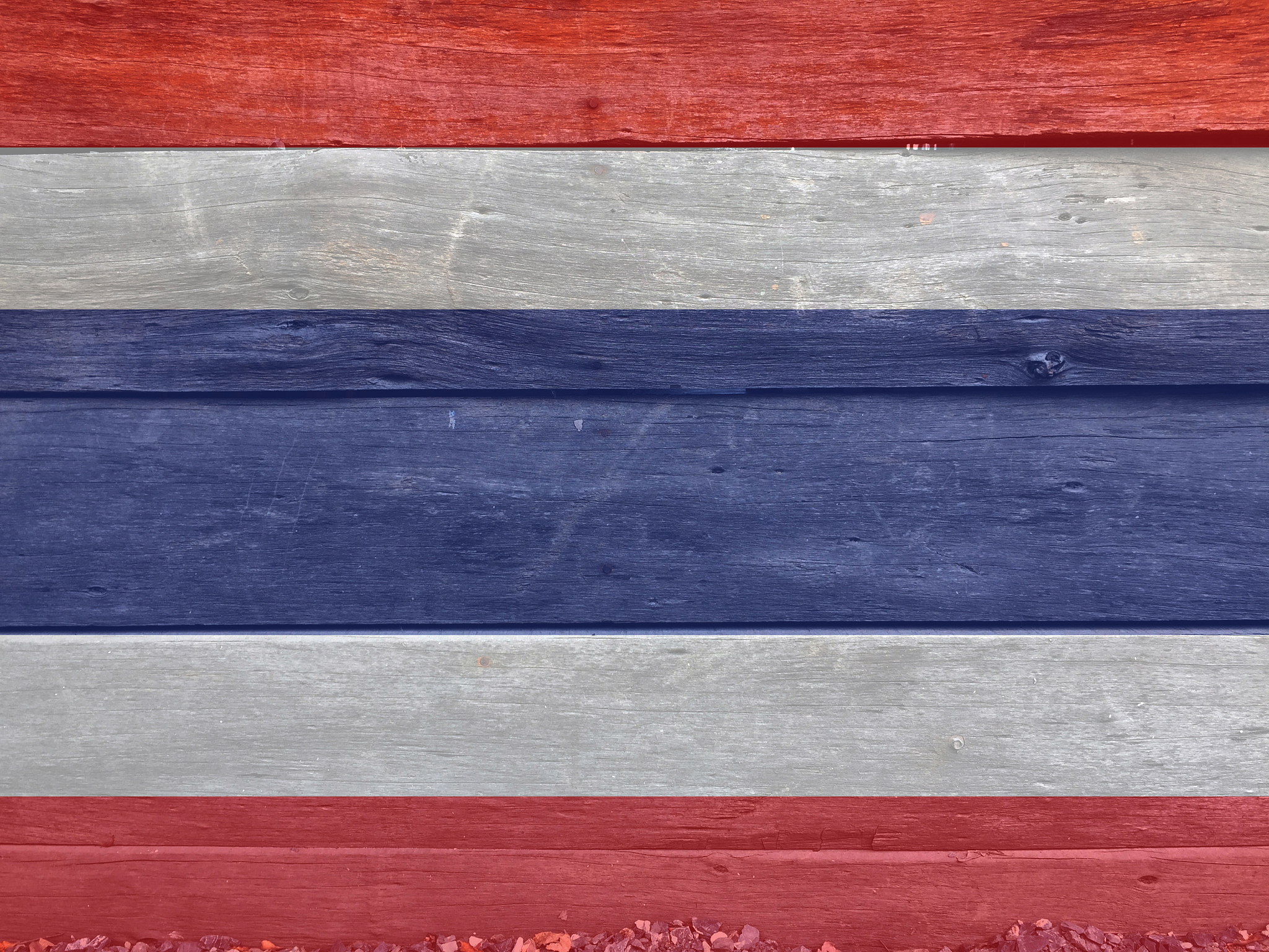 flag of thailand on wooden wall background. grunge thai flag tex