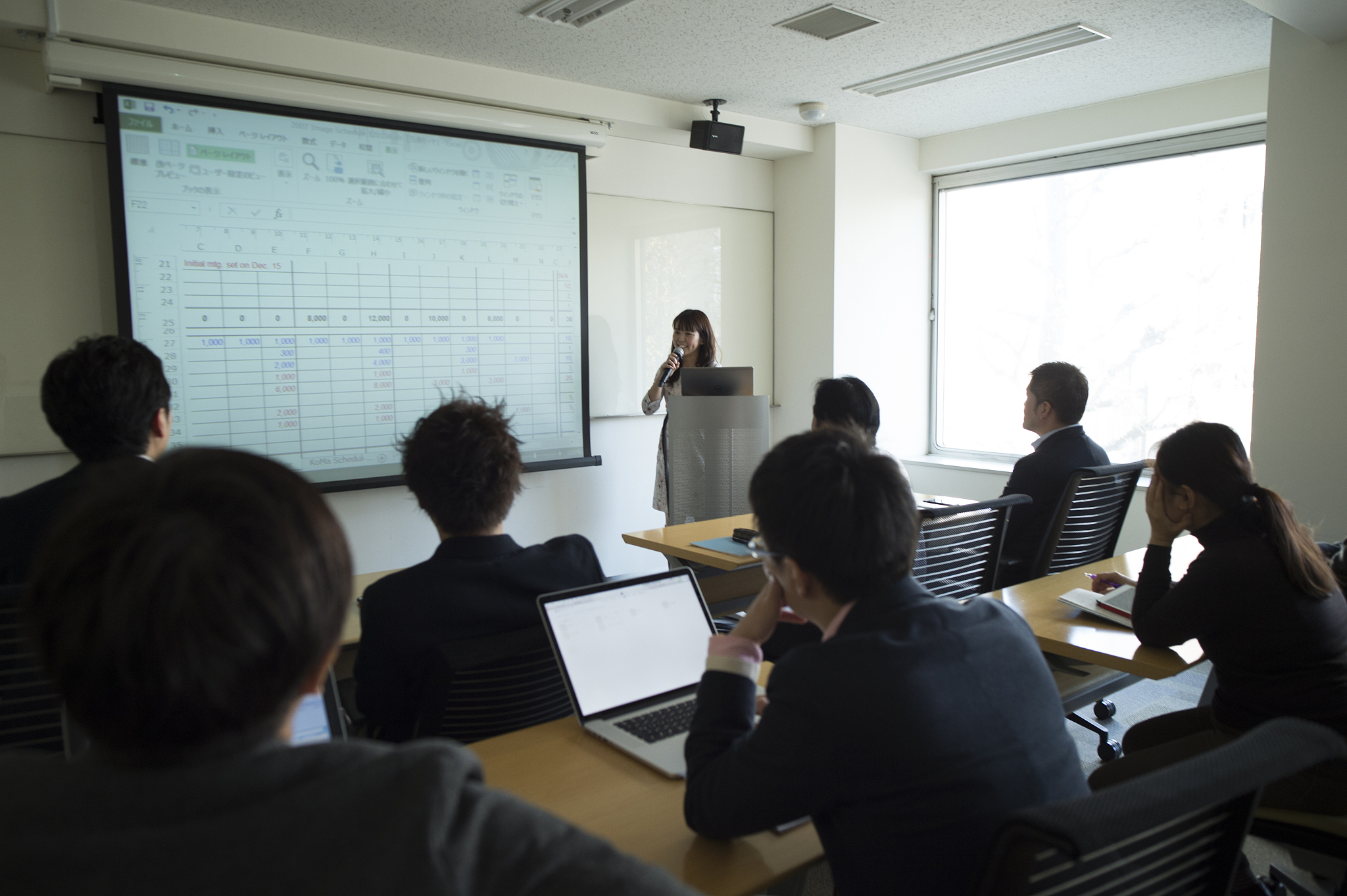 businesswoman leading meeting in conference room