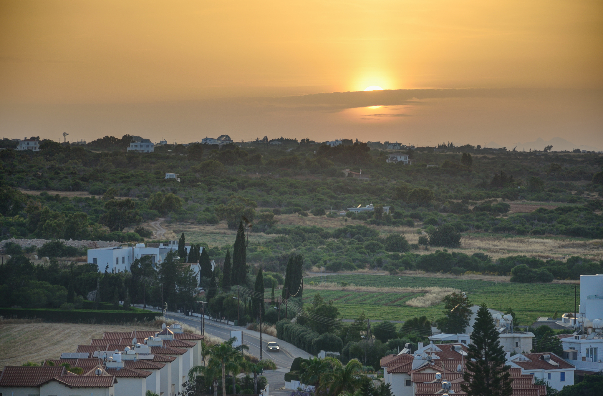 small village at sunset on sunny summer day