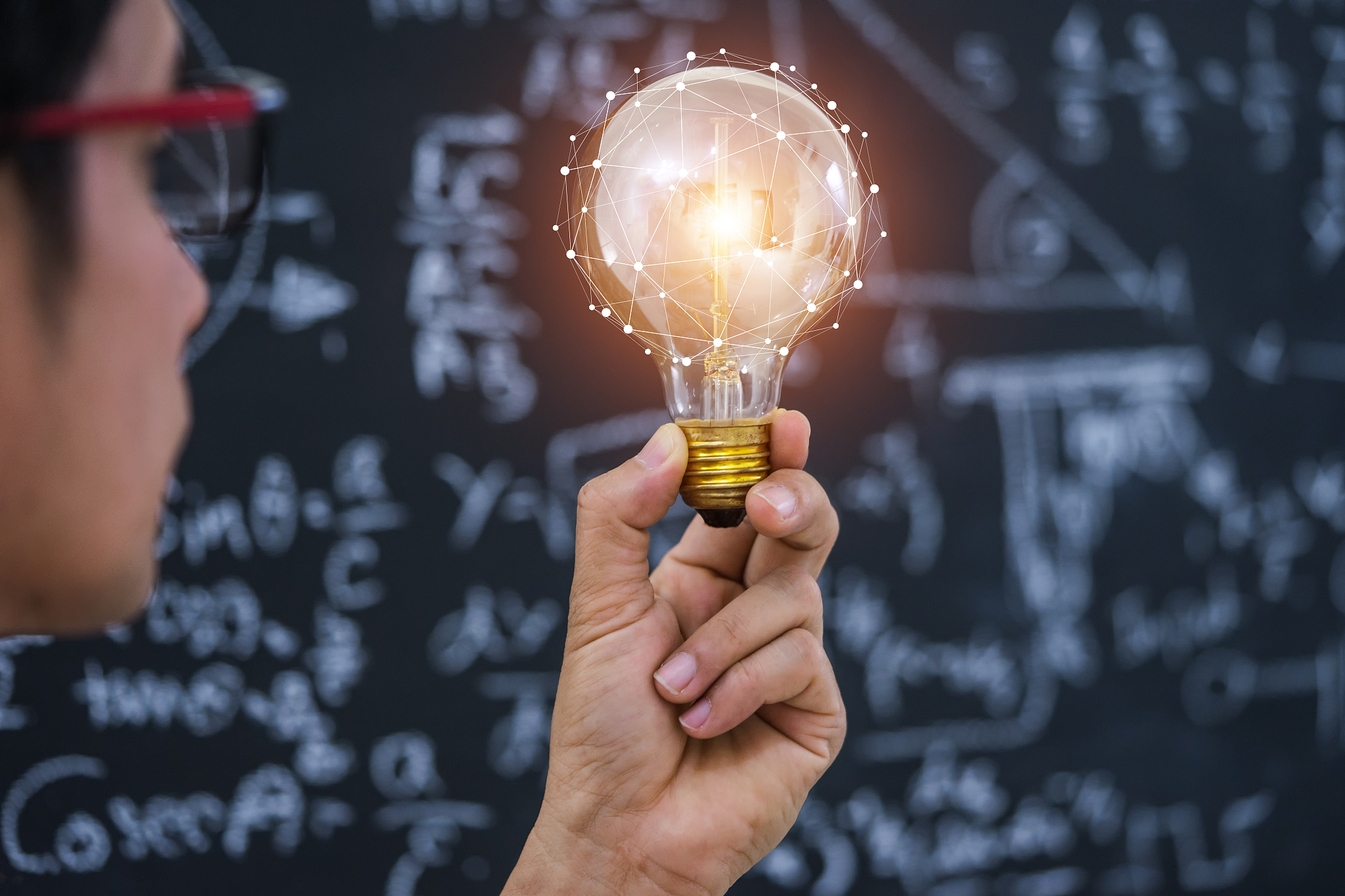hand holding light bulb concept and education.
